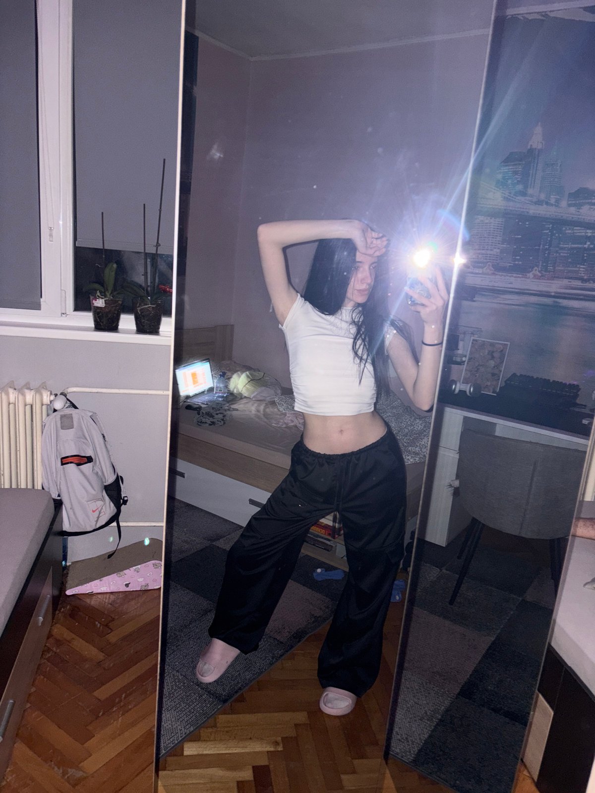 Woman takes mirror selfie in Sofia apartment