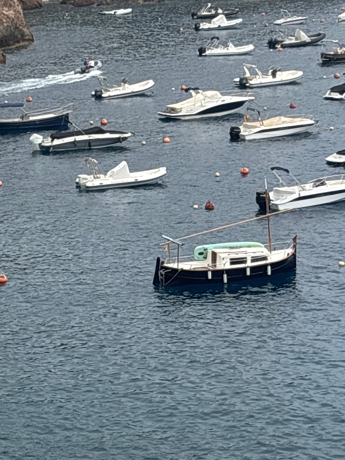 Begur's rocky coves and busy bays on a calm summer morning