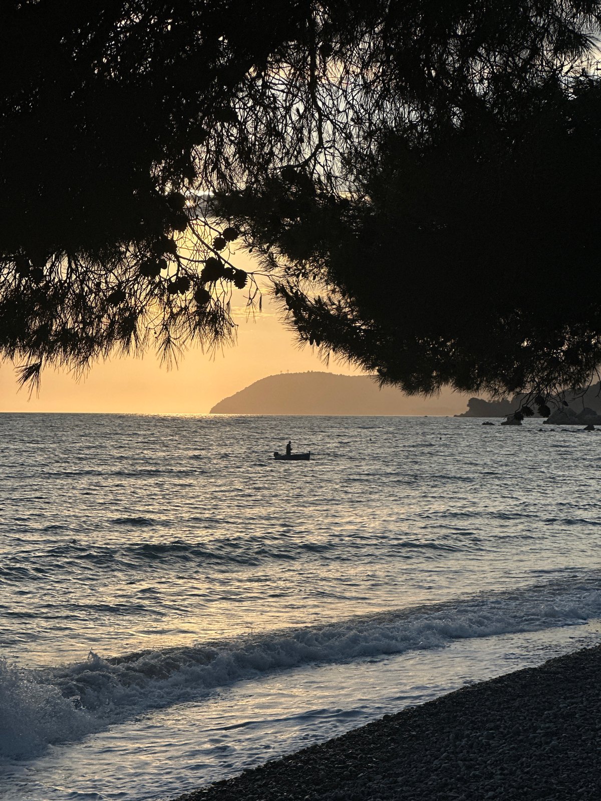 Paddleboarder enjoys calm waters off Montenegro coast