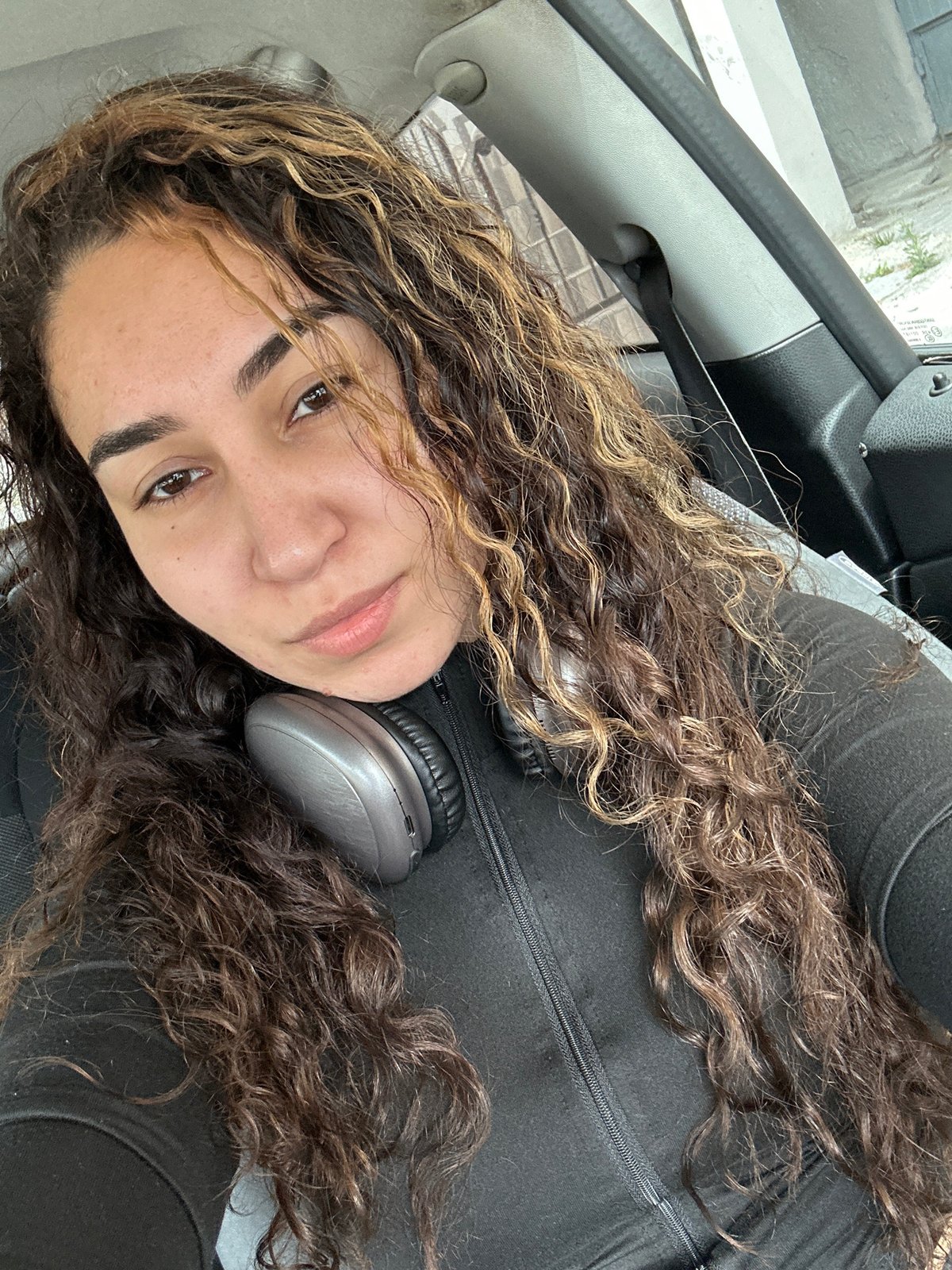 Woman photographed relaxing in car passenger seat in Burgas