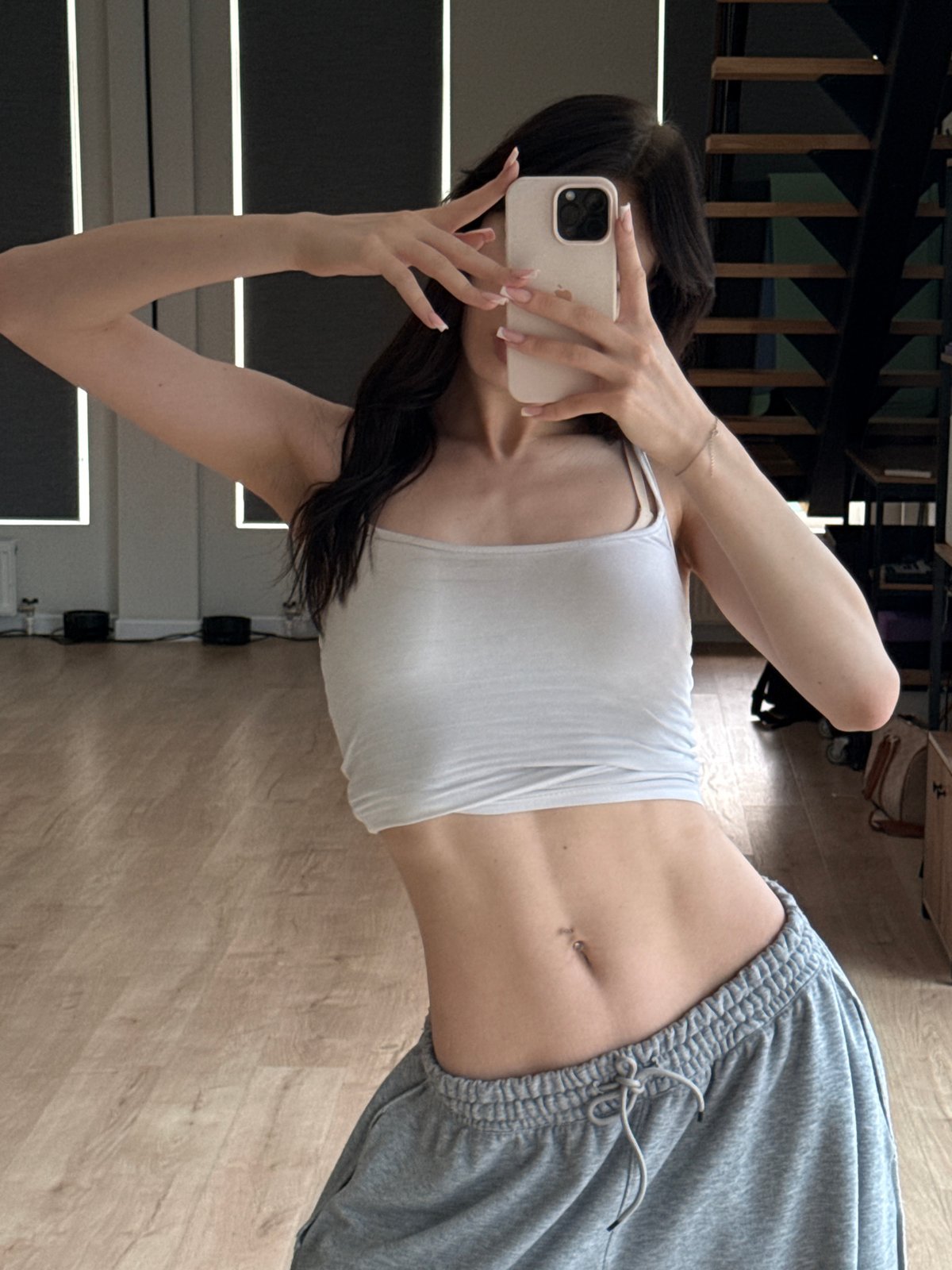 Mirror selfie session at a Zakharovo apartment, June 2026