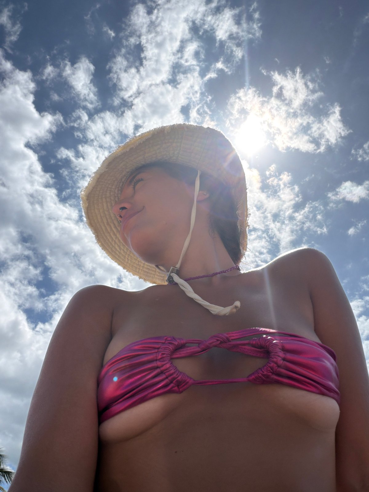 Beachgoer sunbathes at Arugam Bay during morning hours