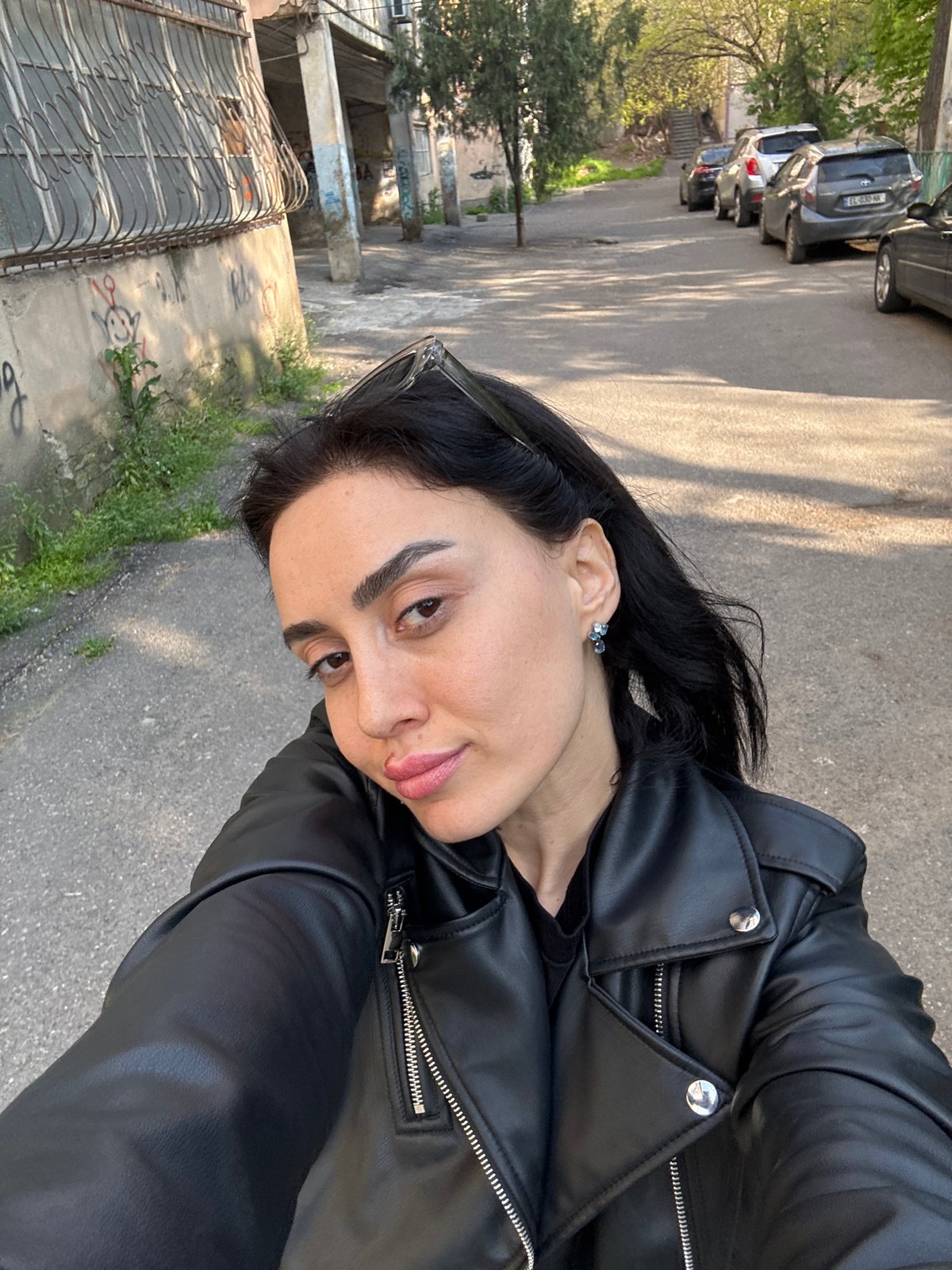 Woman takes playful selfies on Tbilisi street