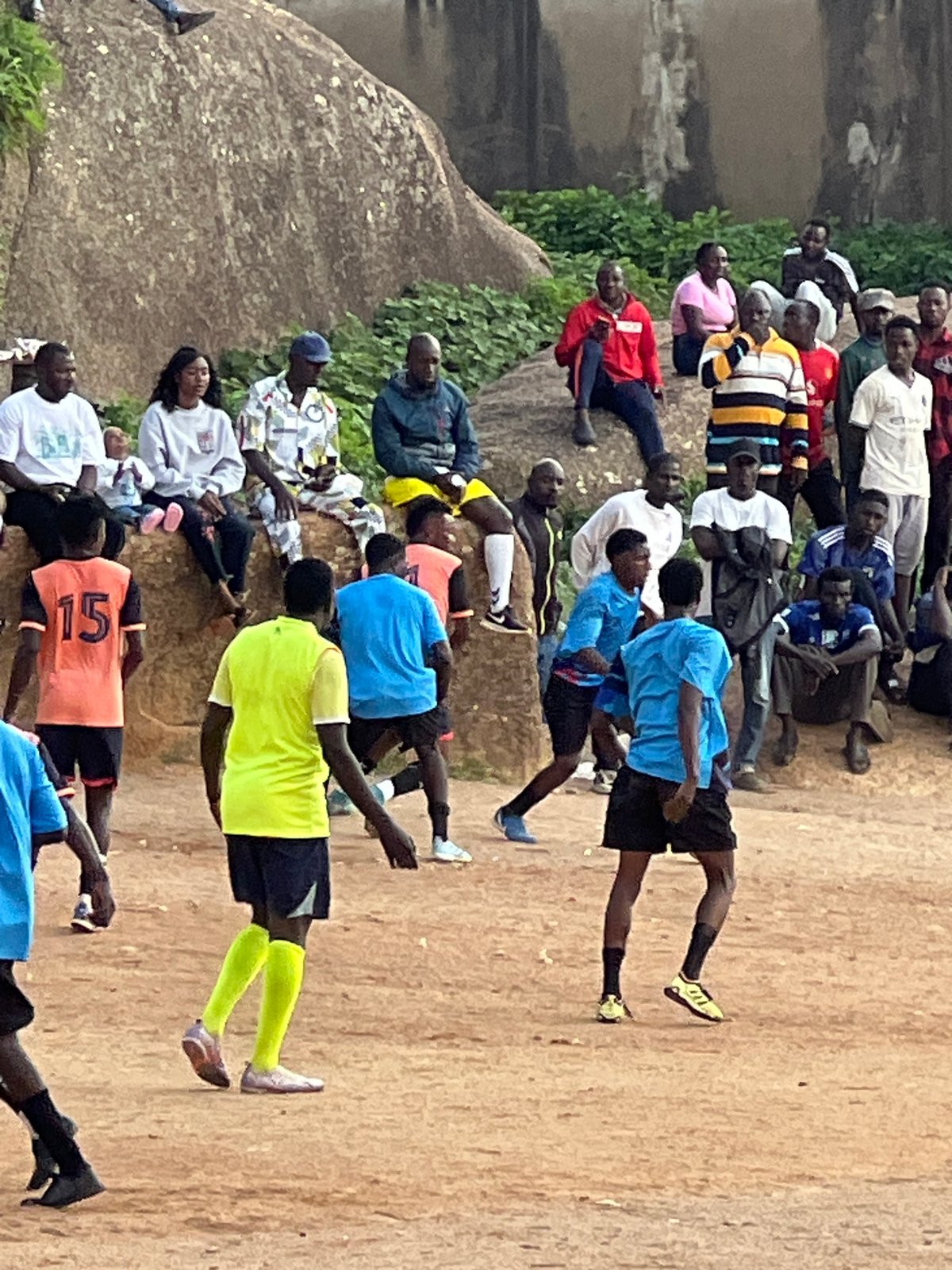 Pickup football on rocky open ground in Jos, Nigeria