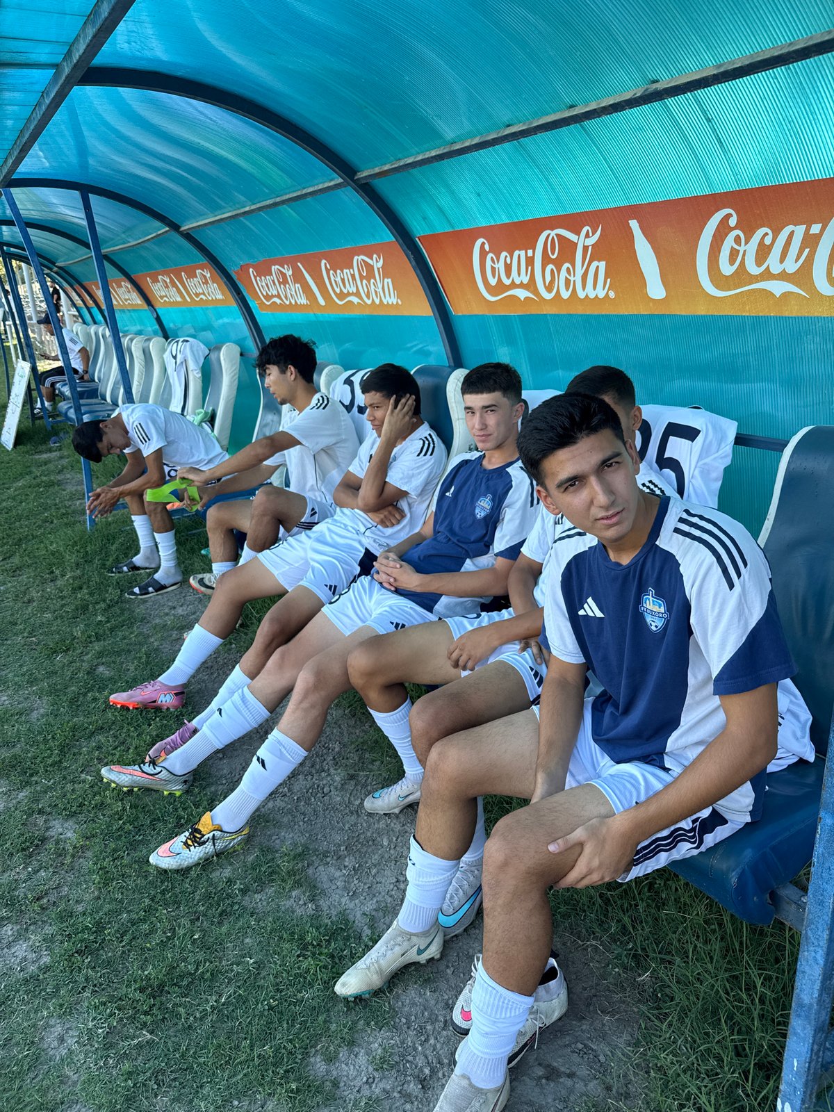 Soccer squad trains at a sunny Bukhara sports facility