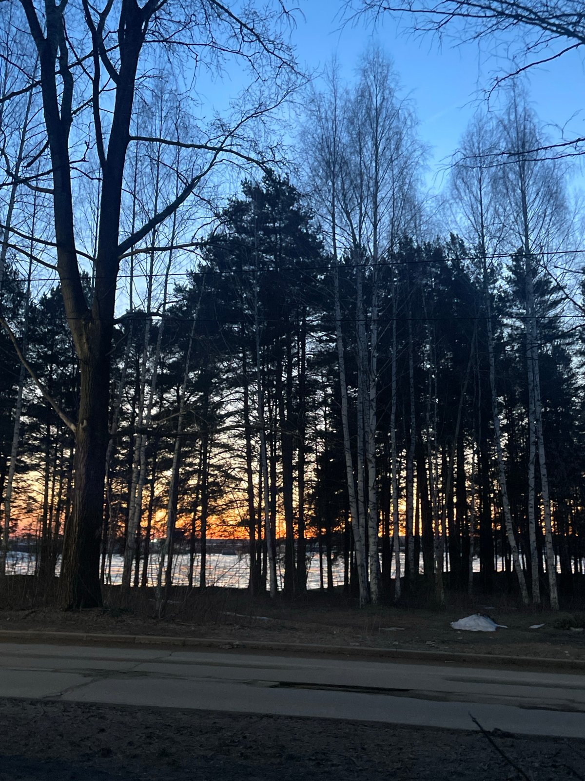 Woman spotted on sidewalk during dusk in Chaikovsky, Russia