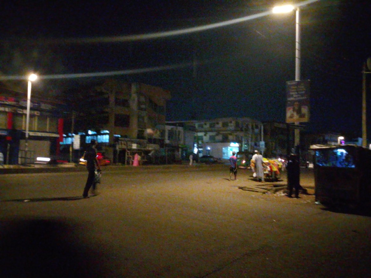 Nighttime streets and text graphics from two Nigerian towns
