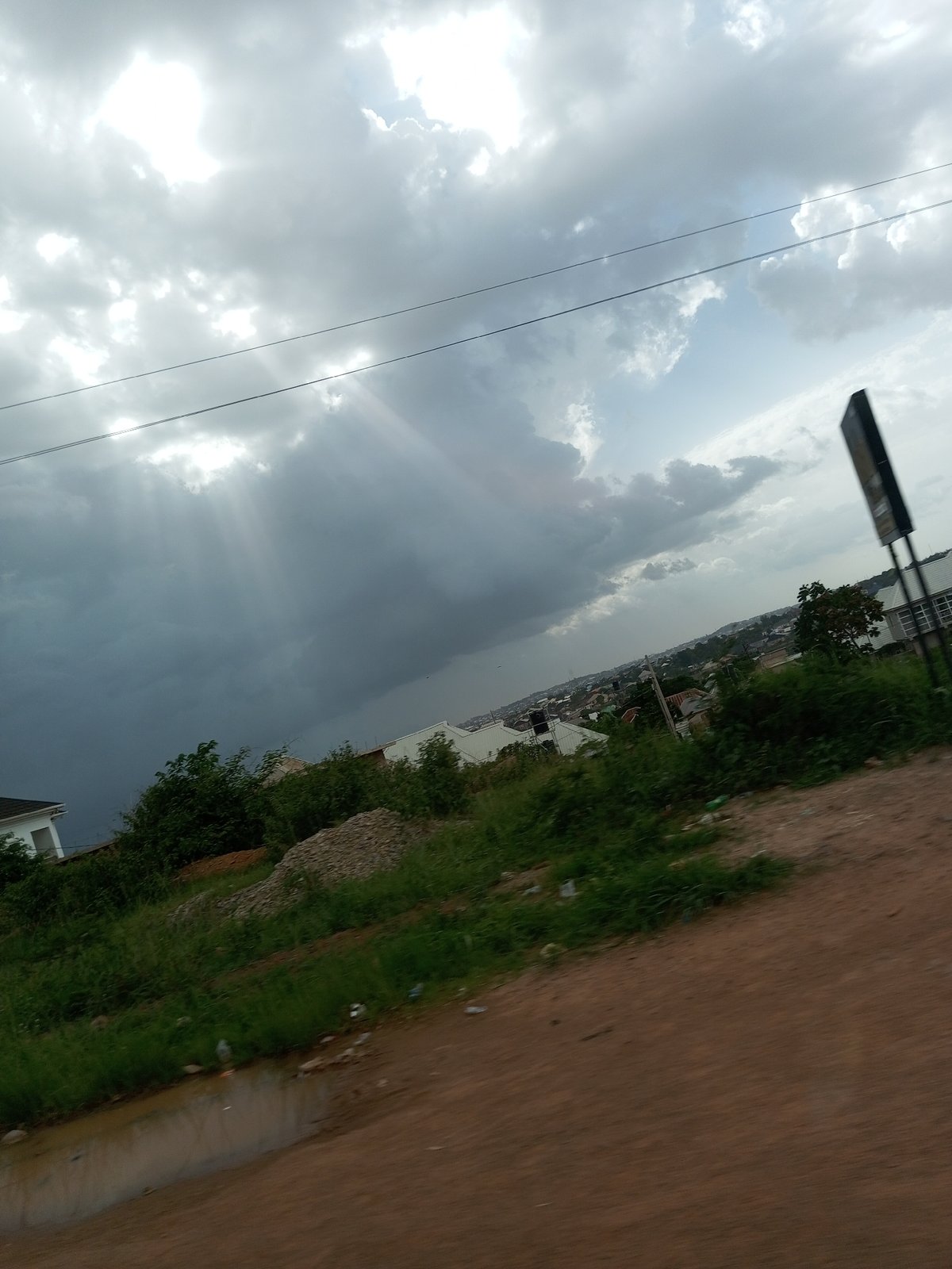 Overcast street scenes across a semi-urban settlement