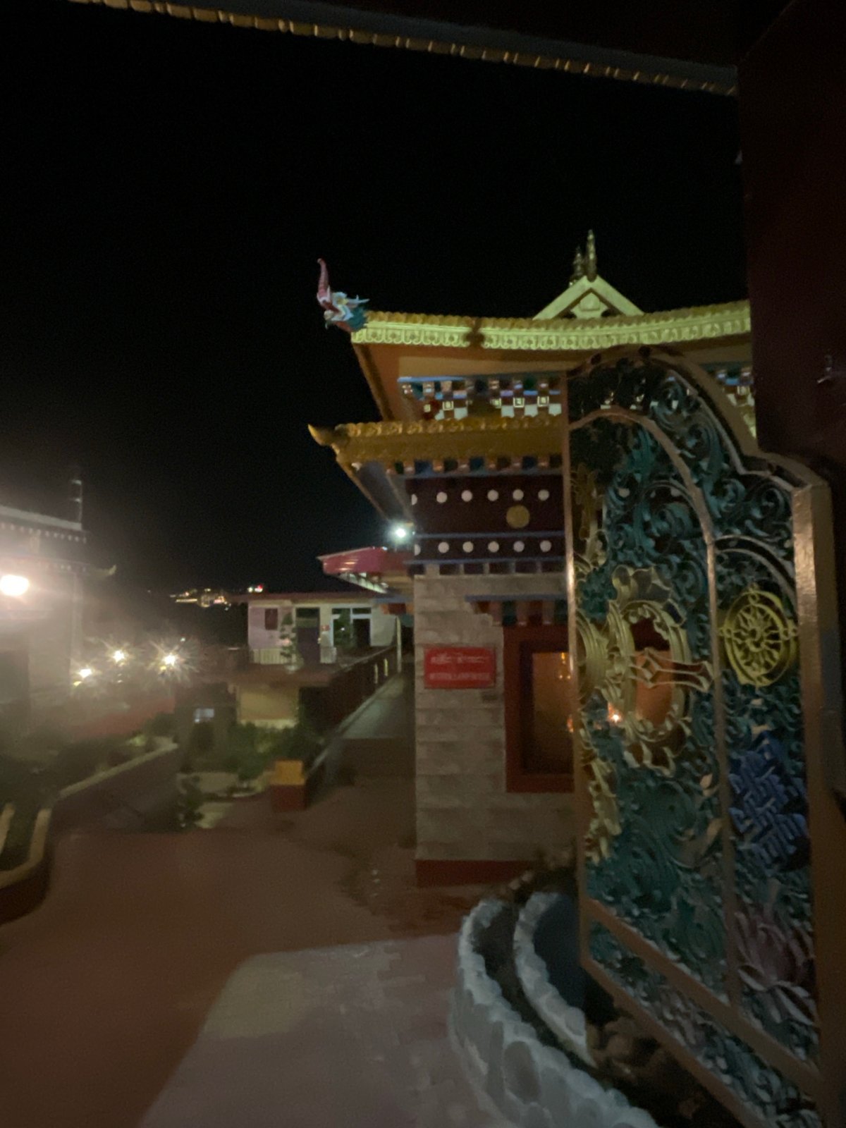 Ornate building with golden accents photographed in Dharamshala