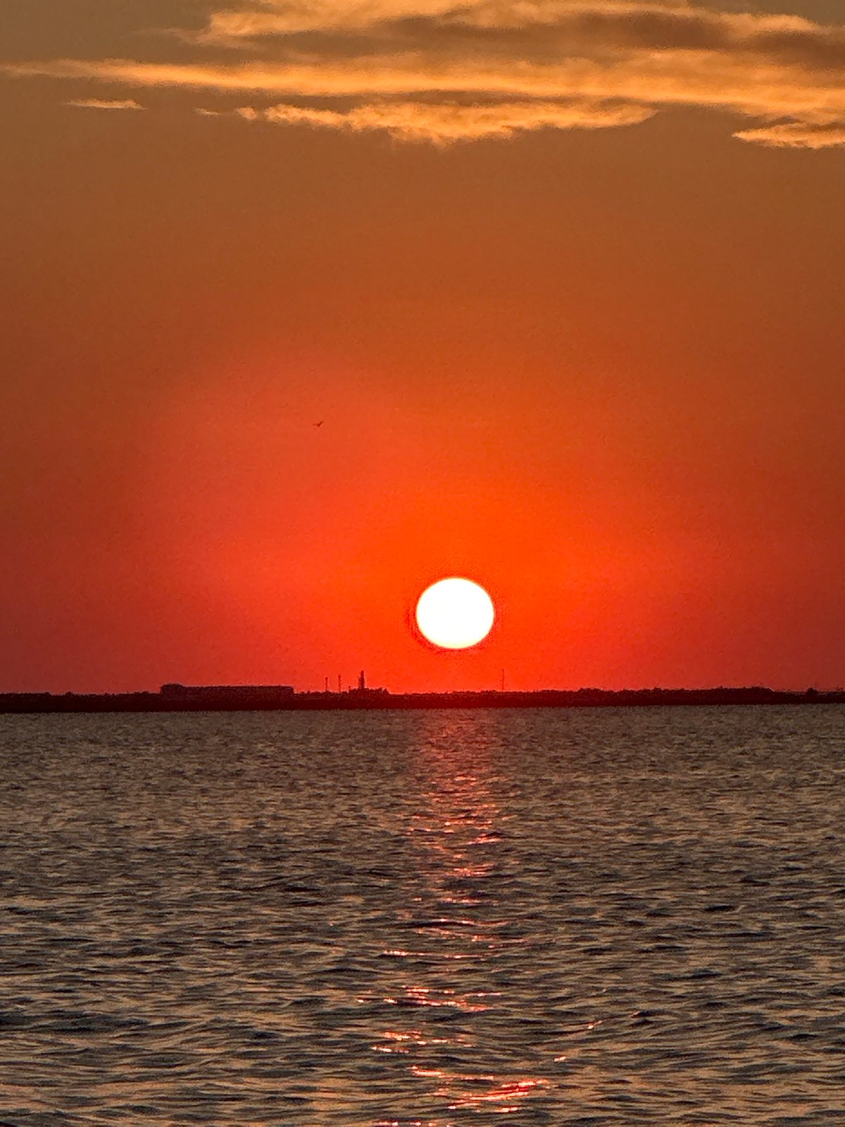 Vivid orange sunset over a Kokshetau lakeside