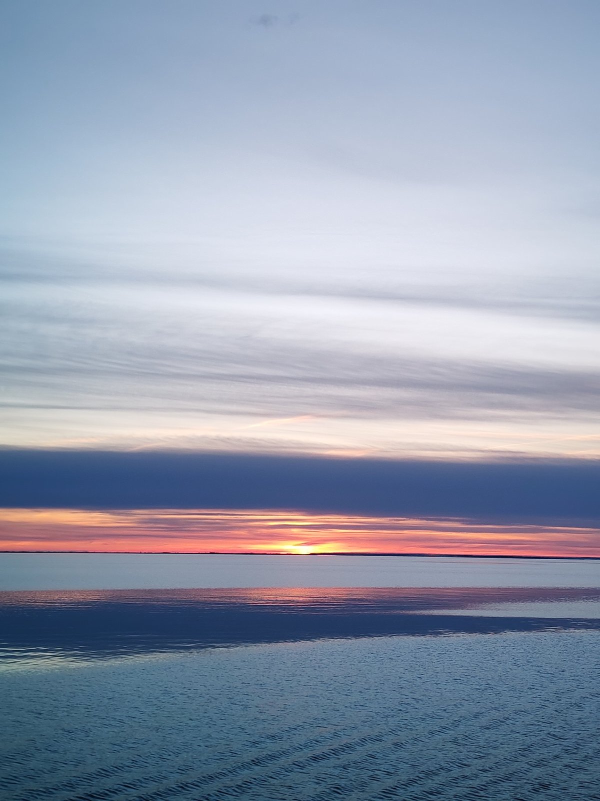 Sunset observed over water in Russia