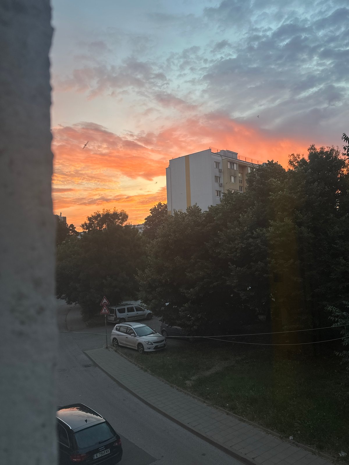 Sunset light over a residential neighborhood, inside and out