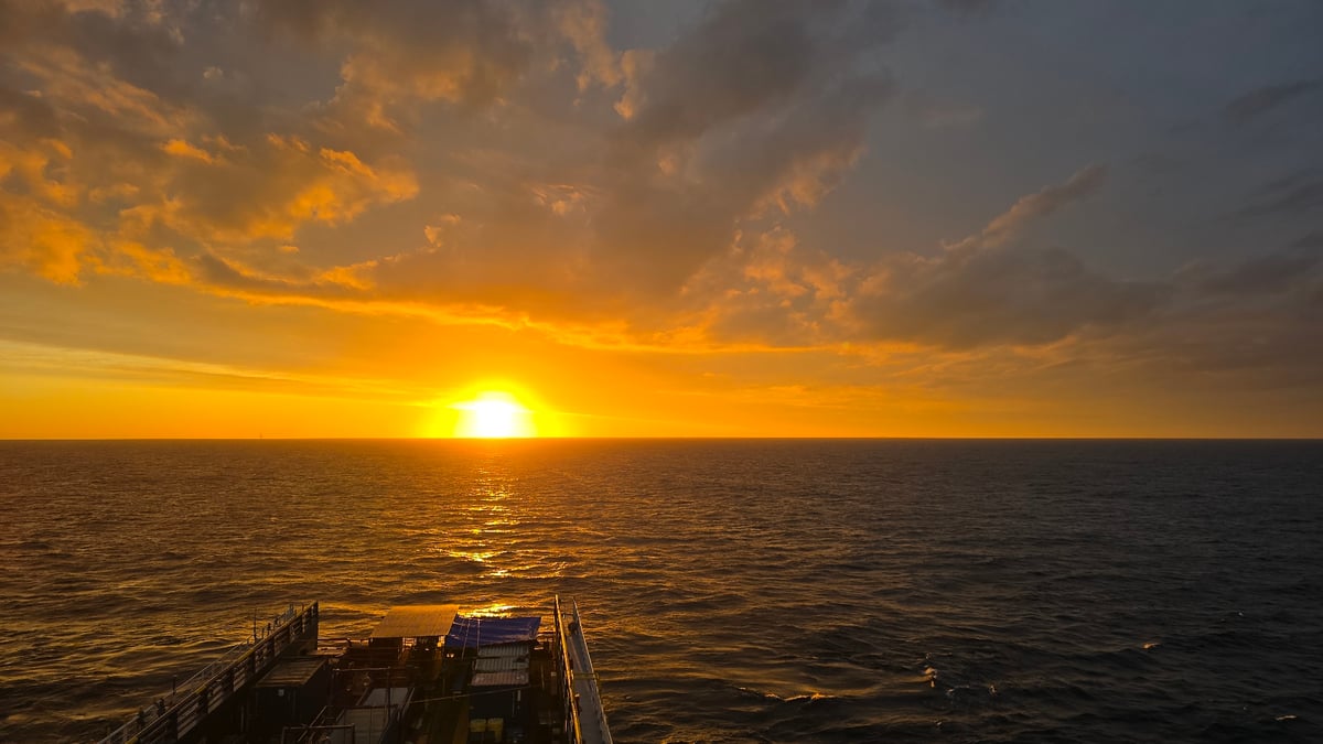 Sunset observed from vessel over ocean waters
