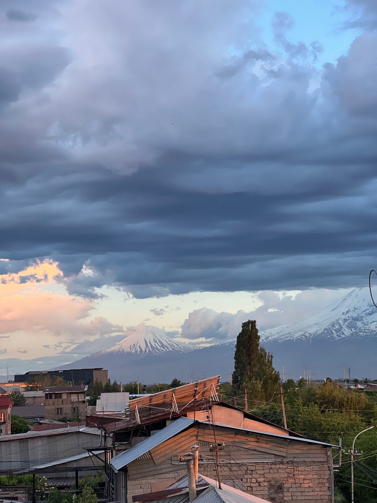 Dramatic sunset illuminates stormy skies over Yerevan, Armenia
