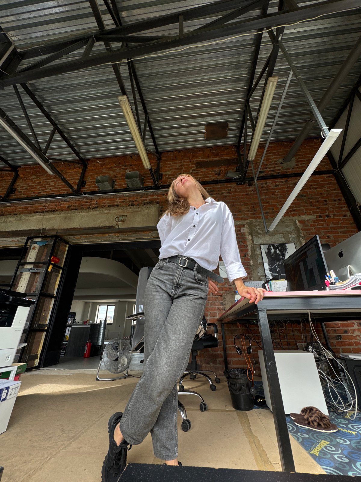 Woman poses in industrial office space in Chaikovsky