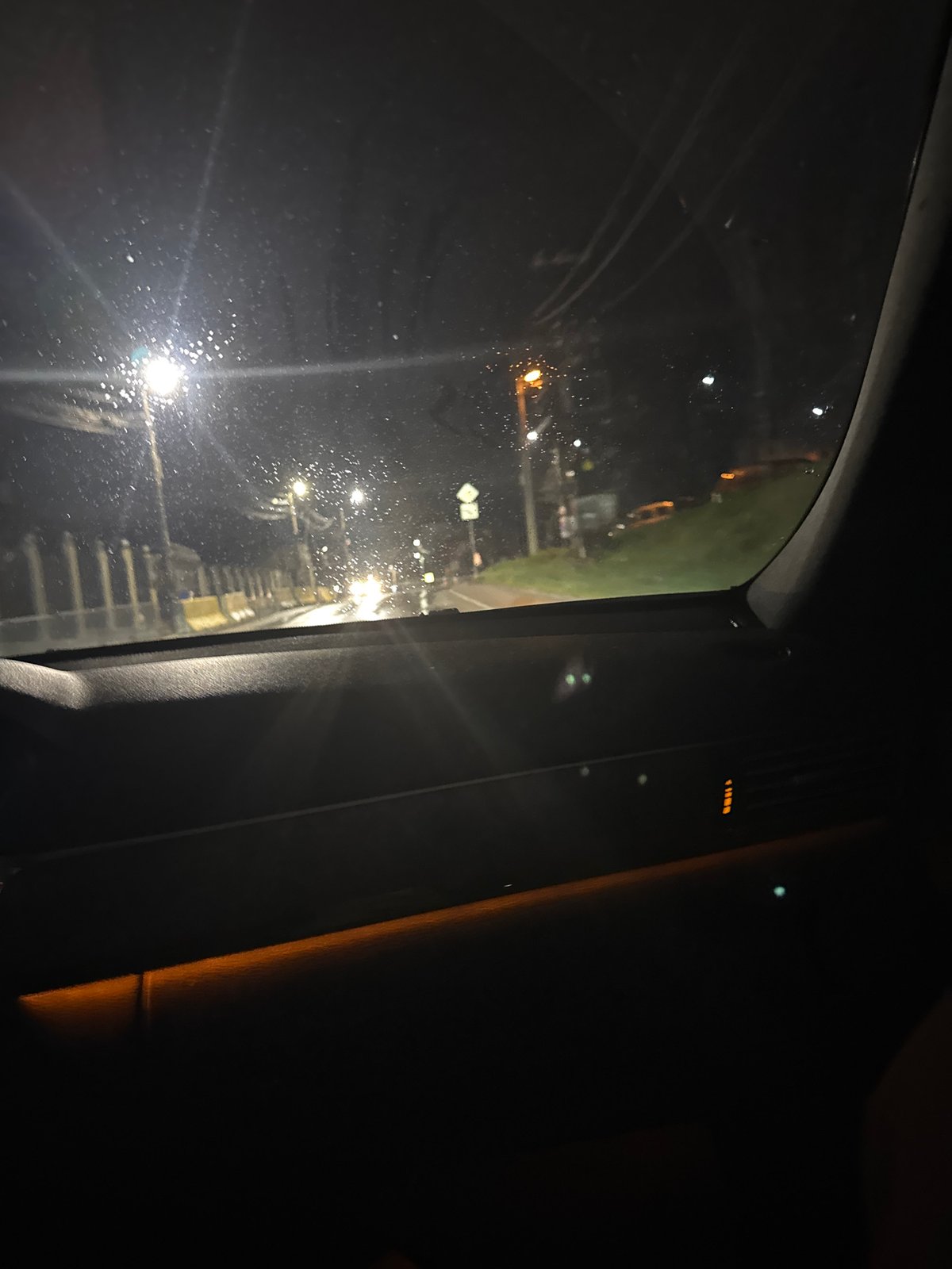 Nighttime view of pedestrian overpass from vehicle in Sofia