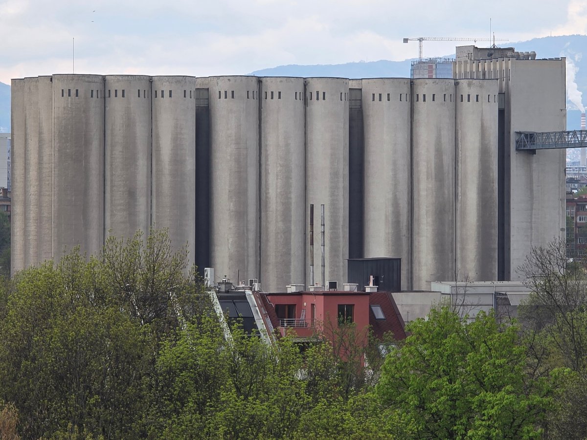 Industrial complex with silos and striped chimneys observed in Sofia