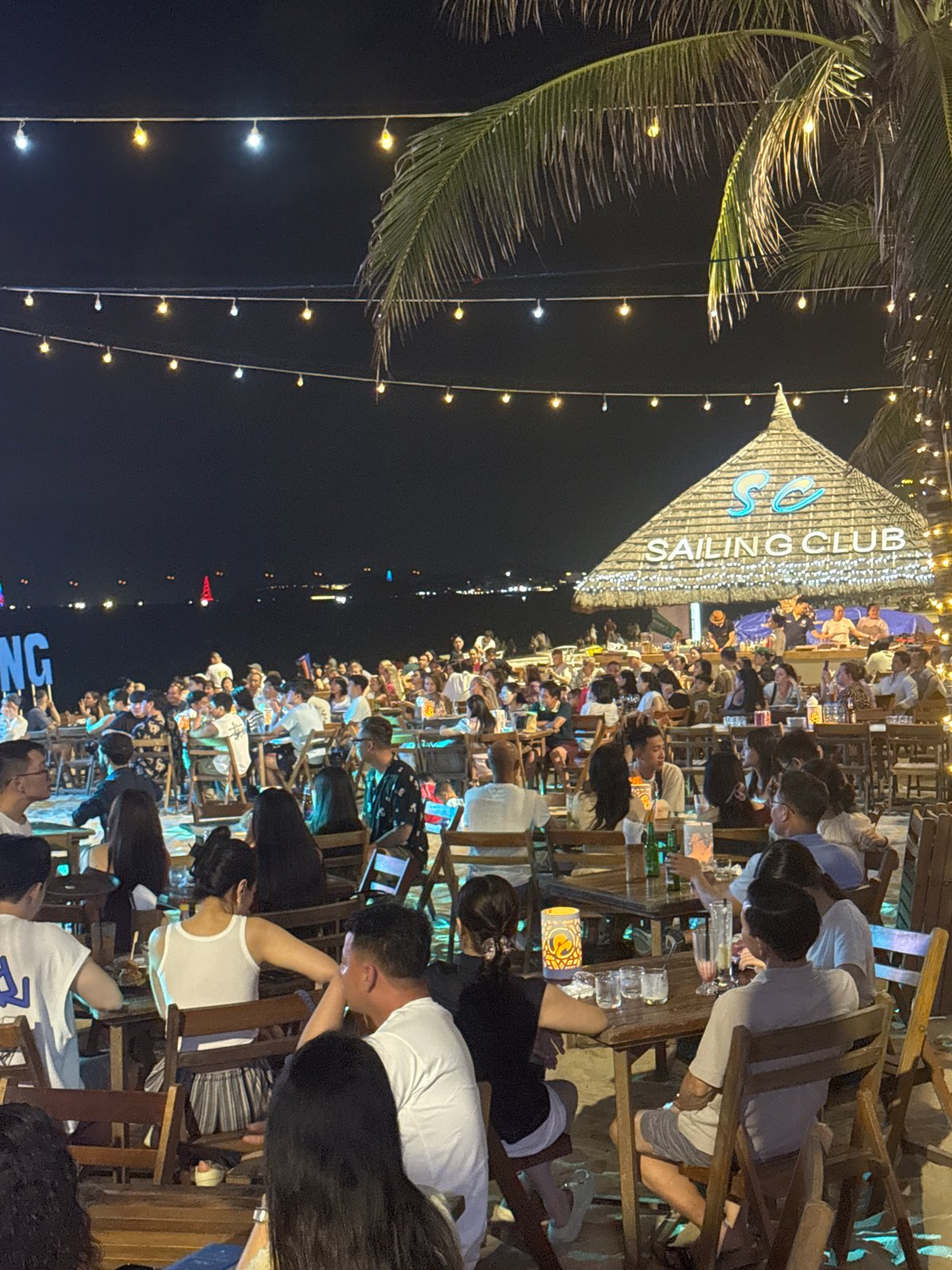 Tourist district scenes captured including beach club, markets, street music