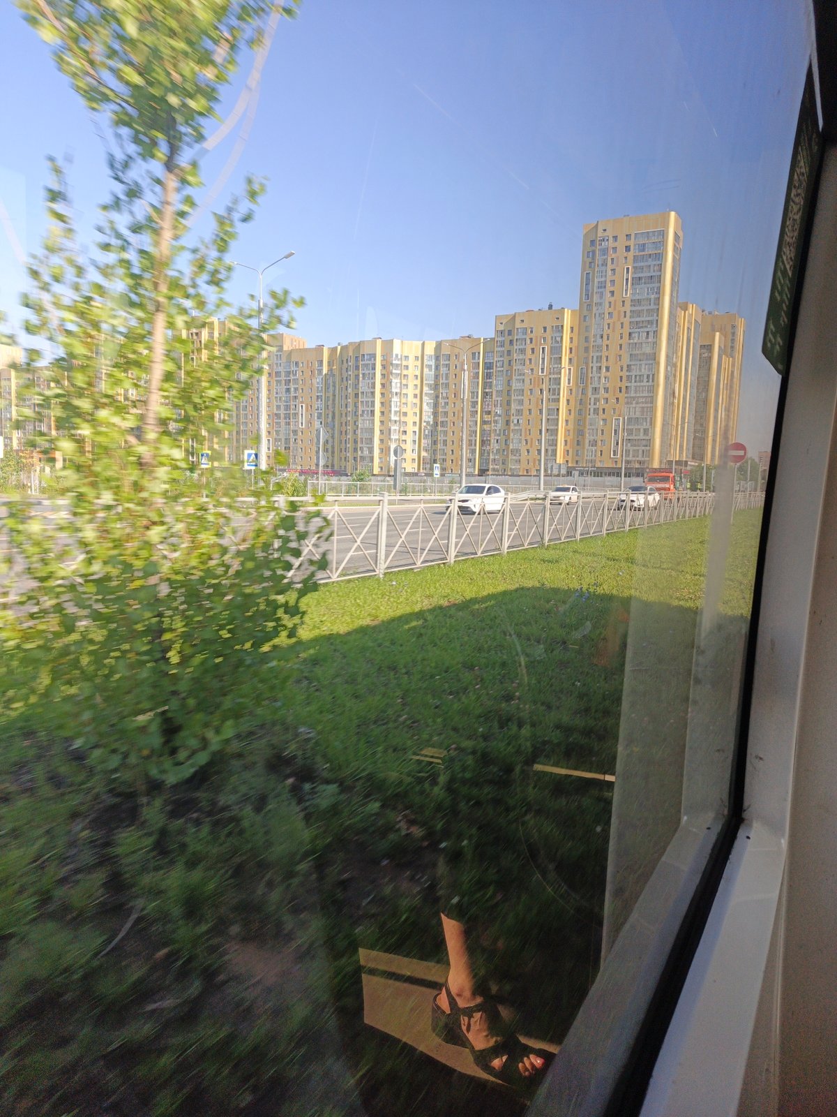 Street-level Kazan: transit views and a covered walkway