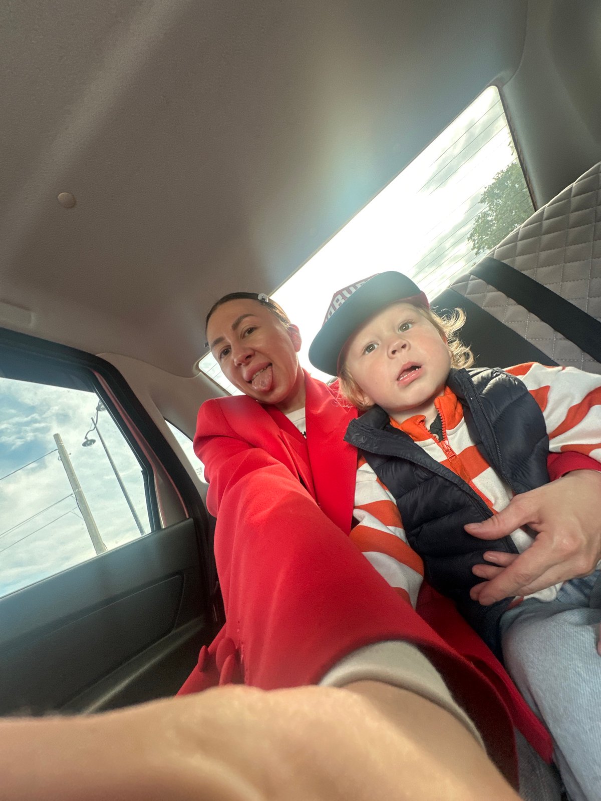 Woman holds child in vehicle in Votkinsk, Russia