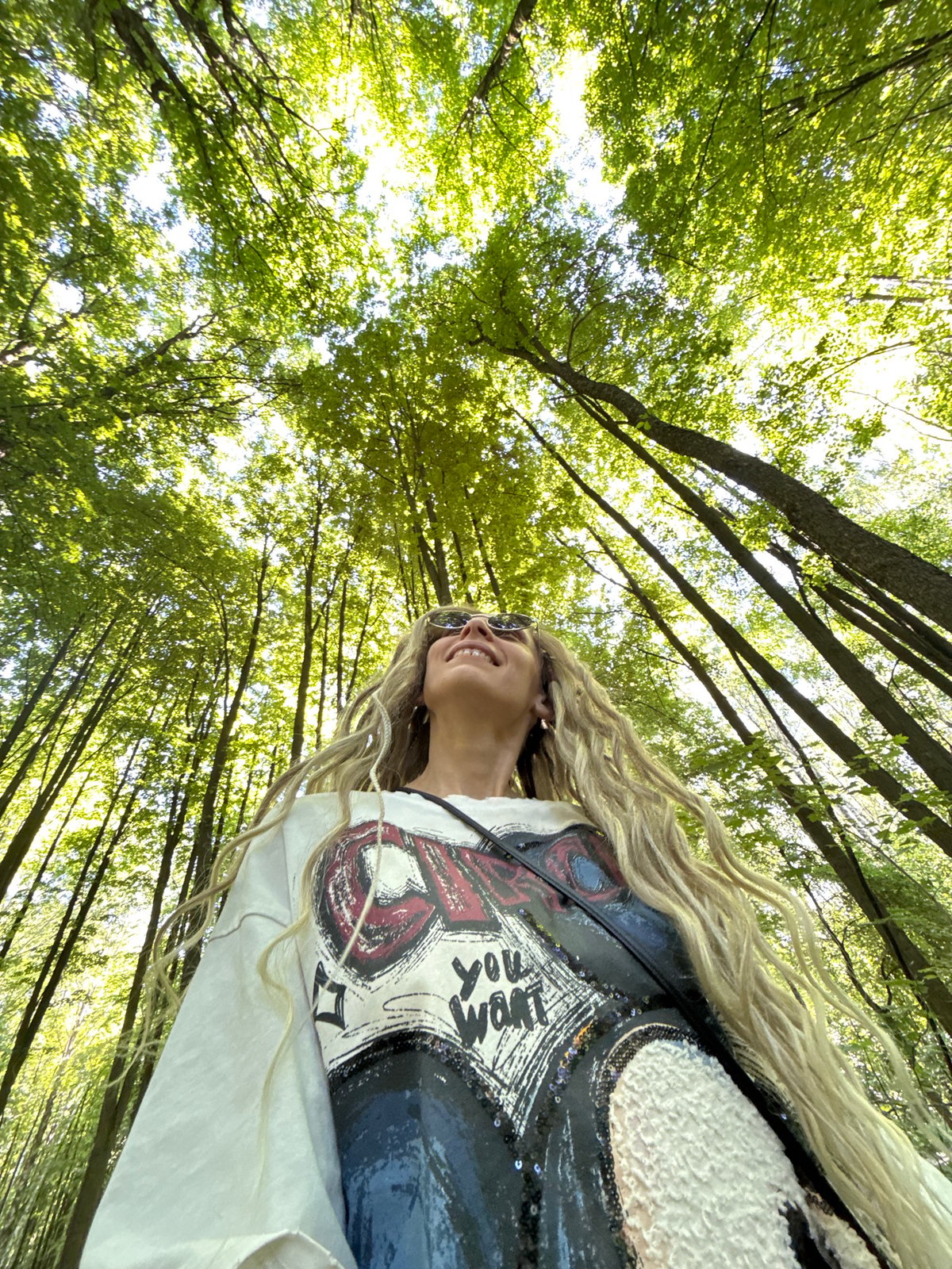 Woman takes forest selfies in Rusanovo, Russia
