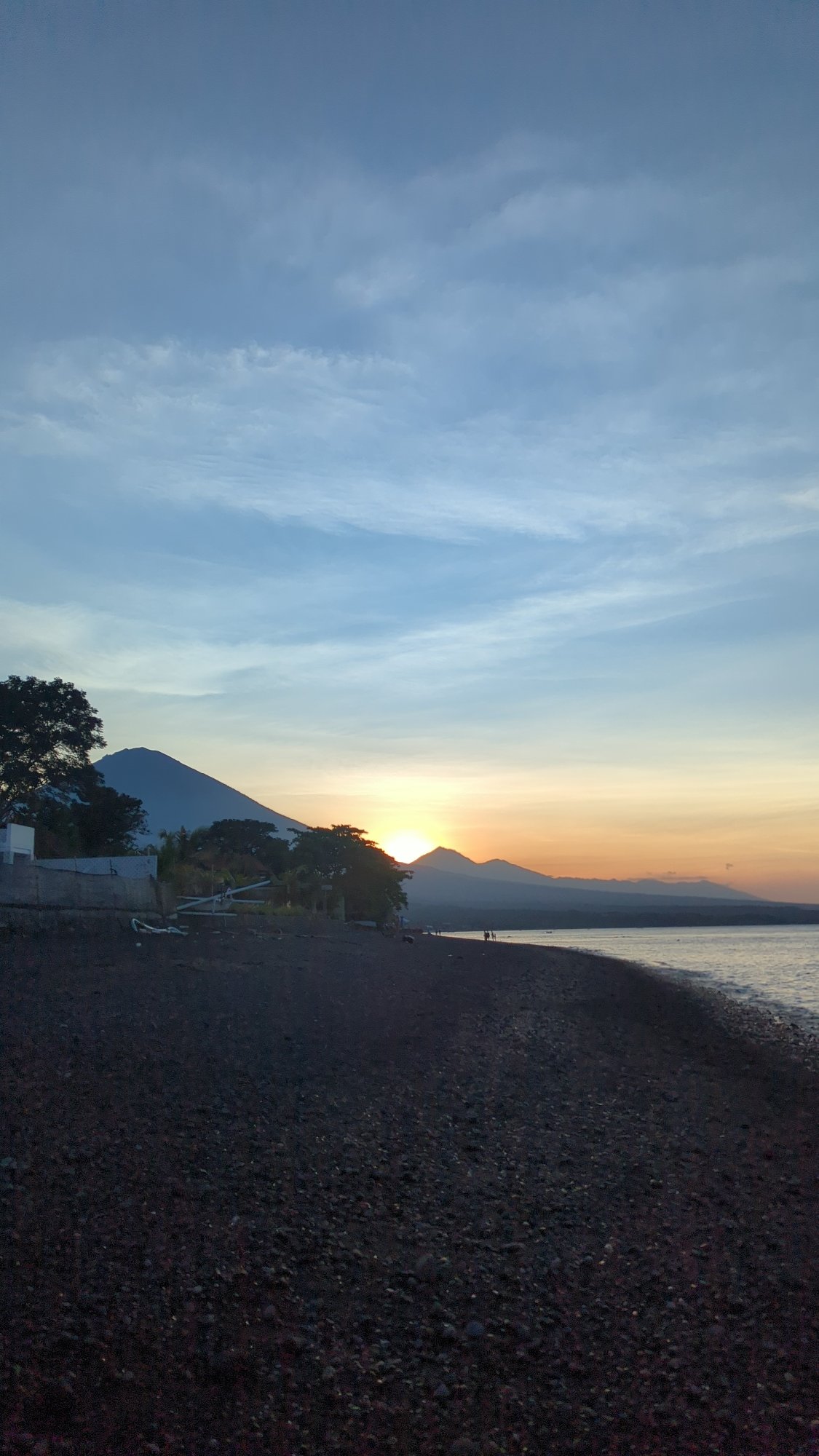 Sunset observed behind mountain range in Abang, Indonesia