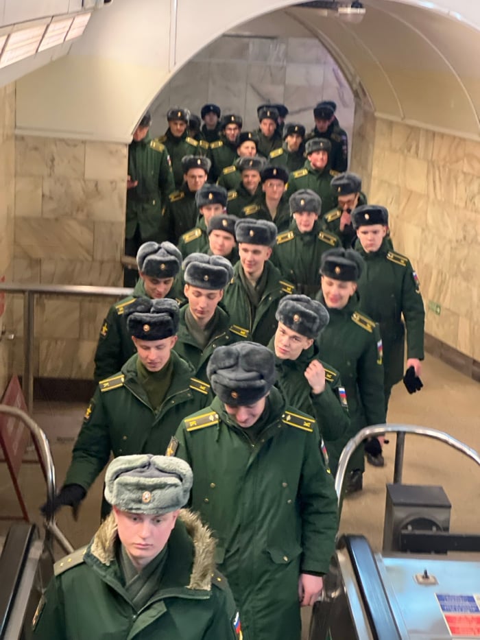 Military unit transits Saint Petersburg metro alongside civilian passengers