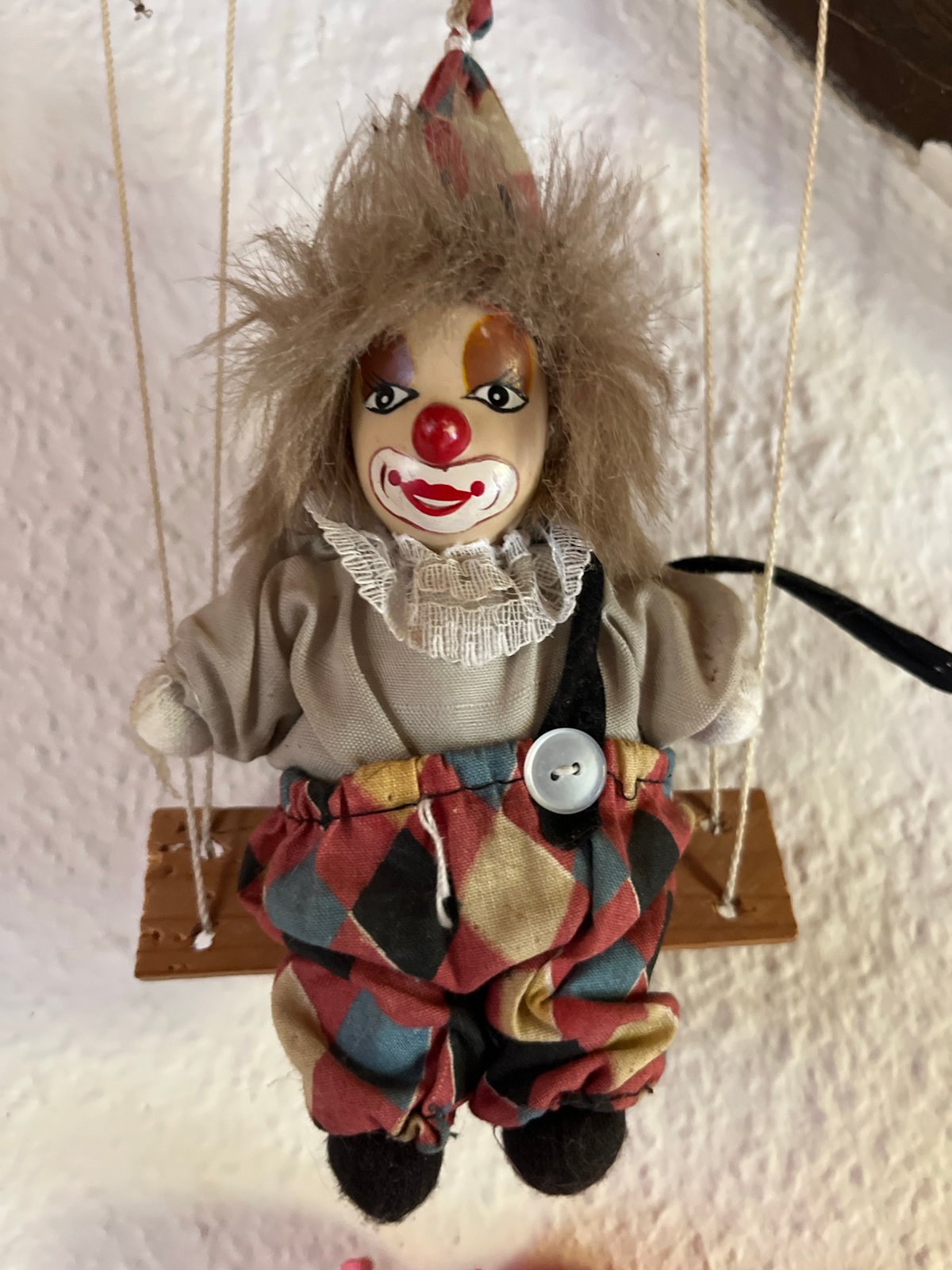 Eclectic personal collection of dolls, horror figures, and curios