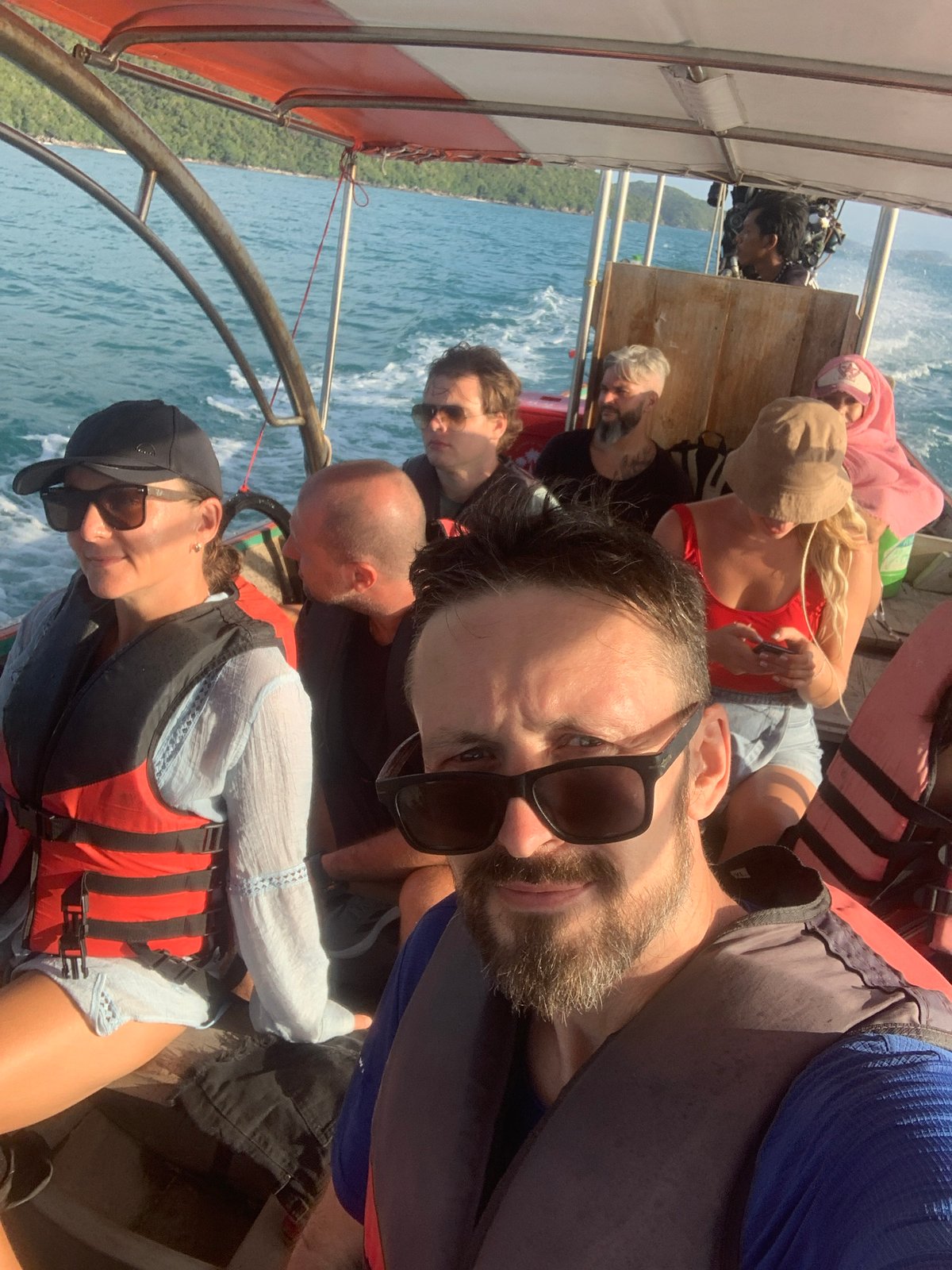 Long-tail boat ride through turquoise waters off Ko Samui