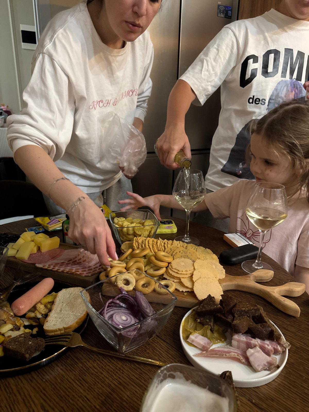 Family gathering with food and drinks documented in Razvilka