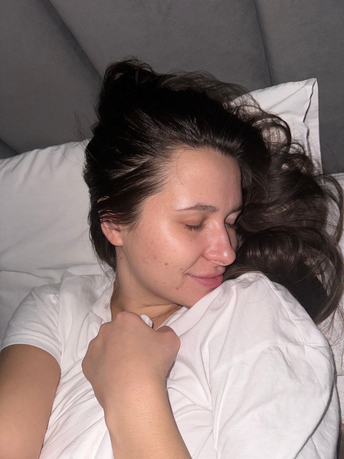 Woman resting on white bedding observed near Akulovo, Russia