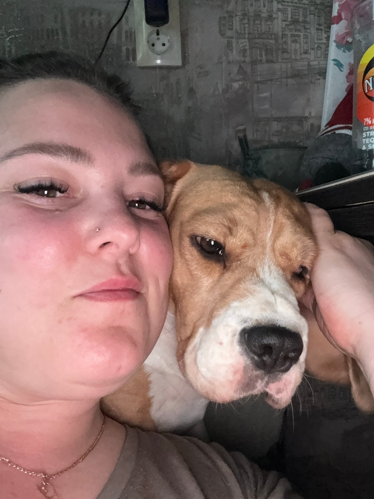 Woman and dog share quiet afternoon moments in Markovskiy