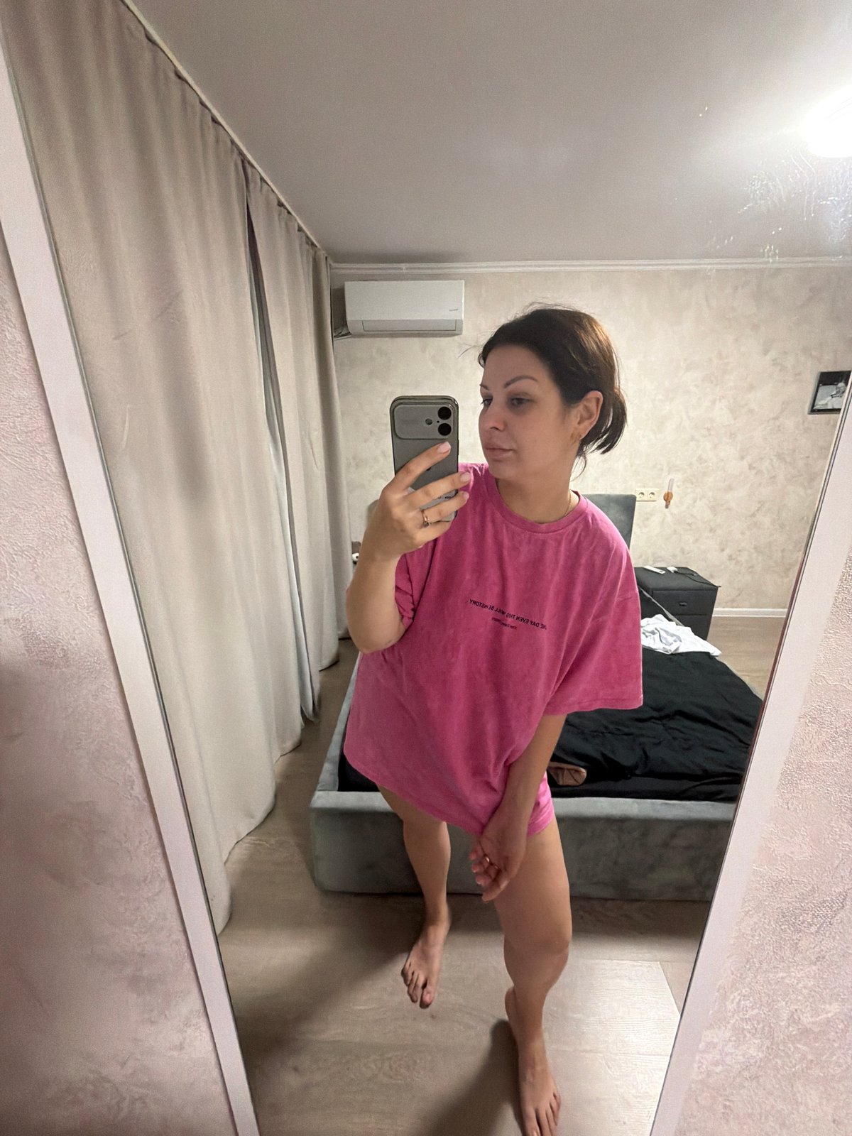 Woman documents evening selfie session in Sochi bedroom