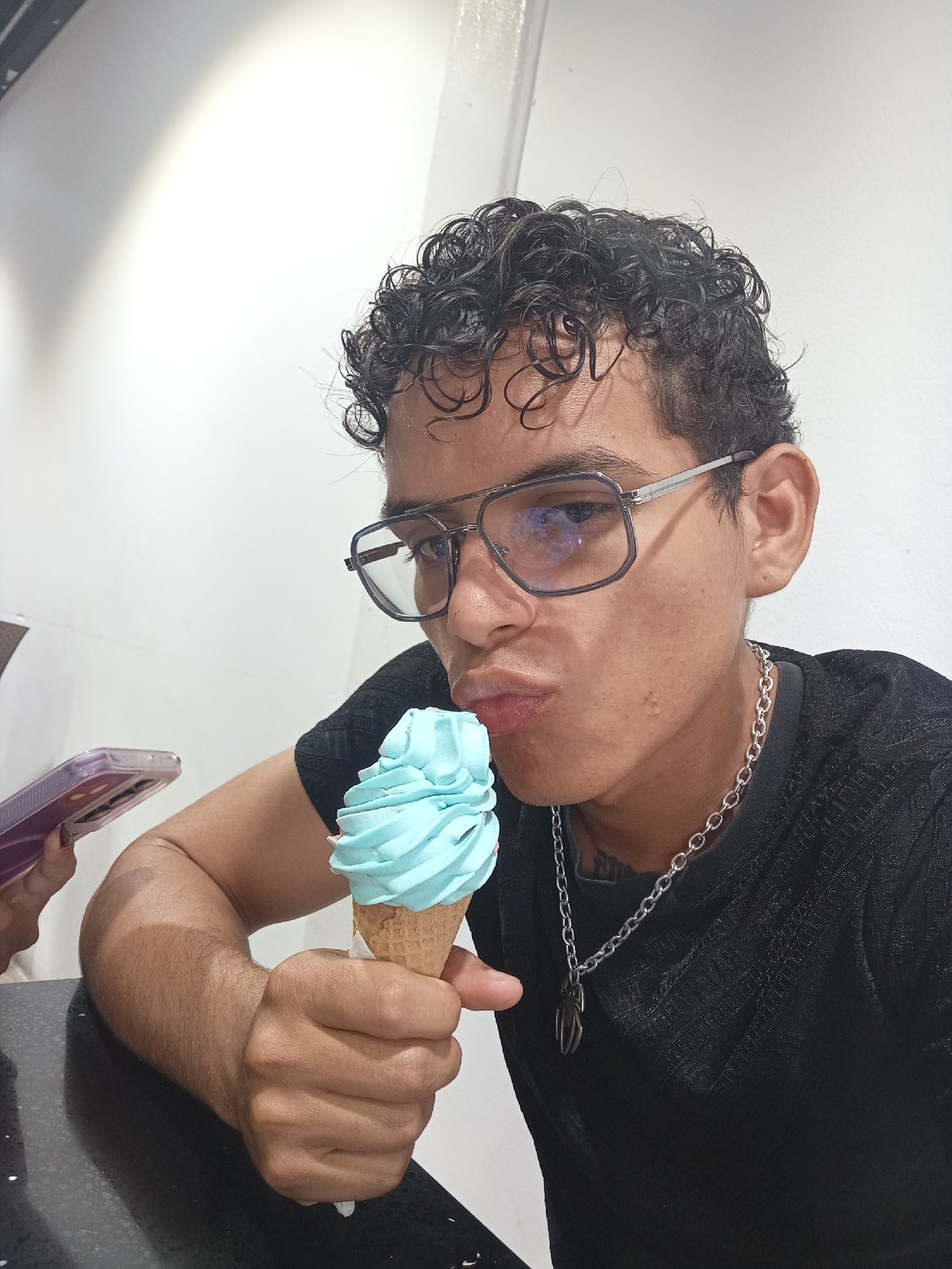 Young couple enjoys ice cream date at Juan Griego cafe