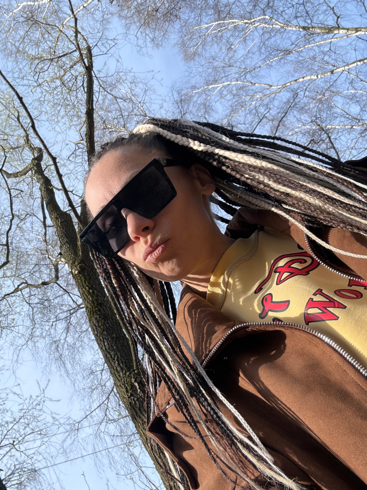 Person in braids photographed outdoors in Rusanovo, Russia