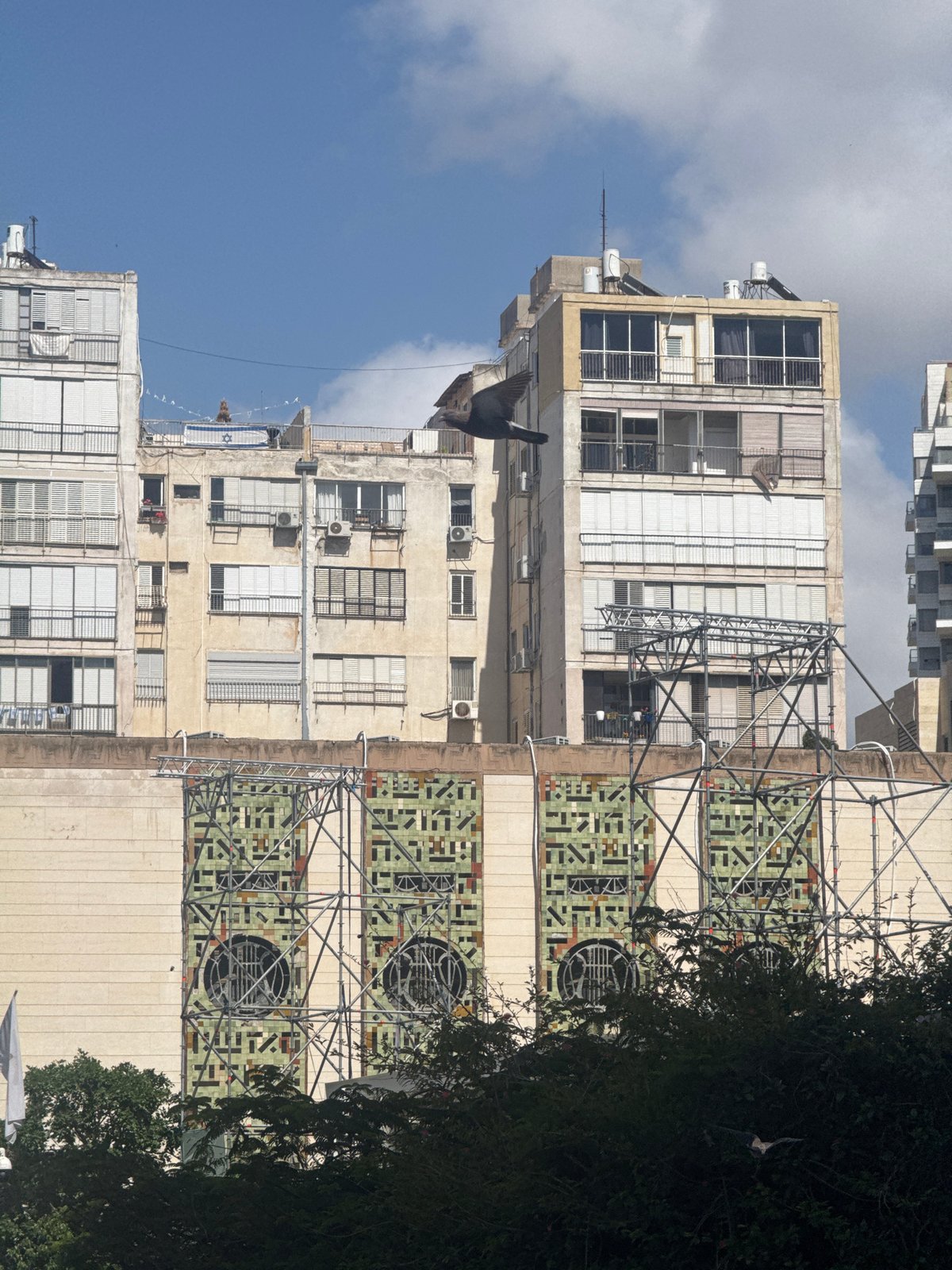 Apartment building with geometric tile patterns observed in Ramat Gan