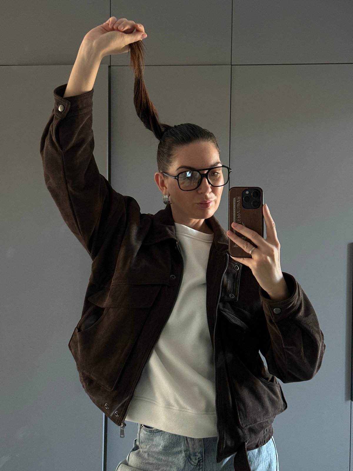 Woman takes selfie while posing in Chaikovsky, Russia