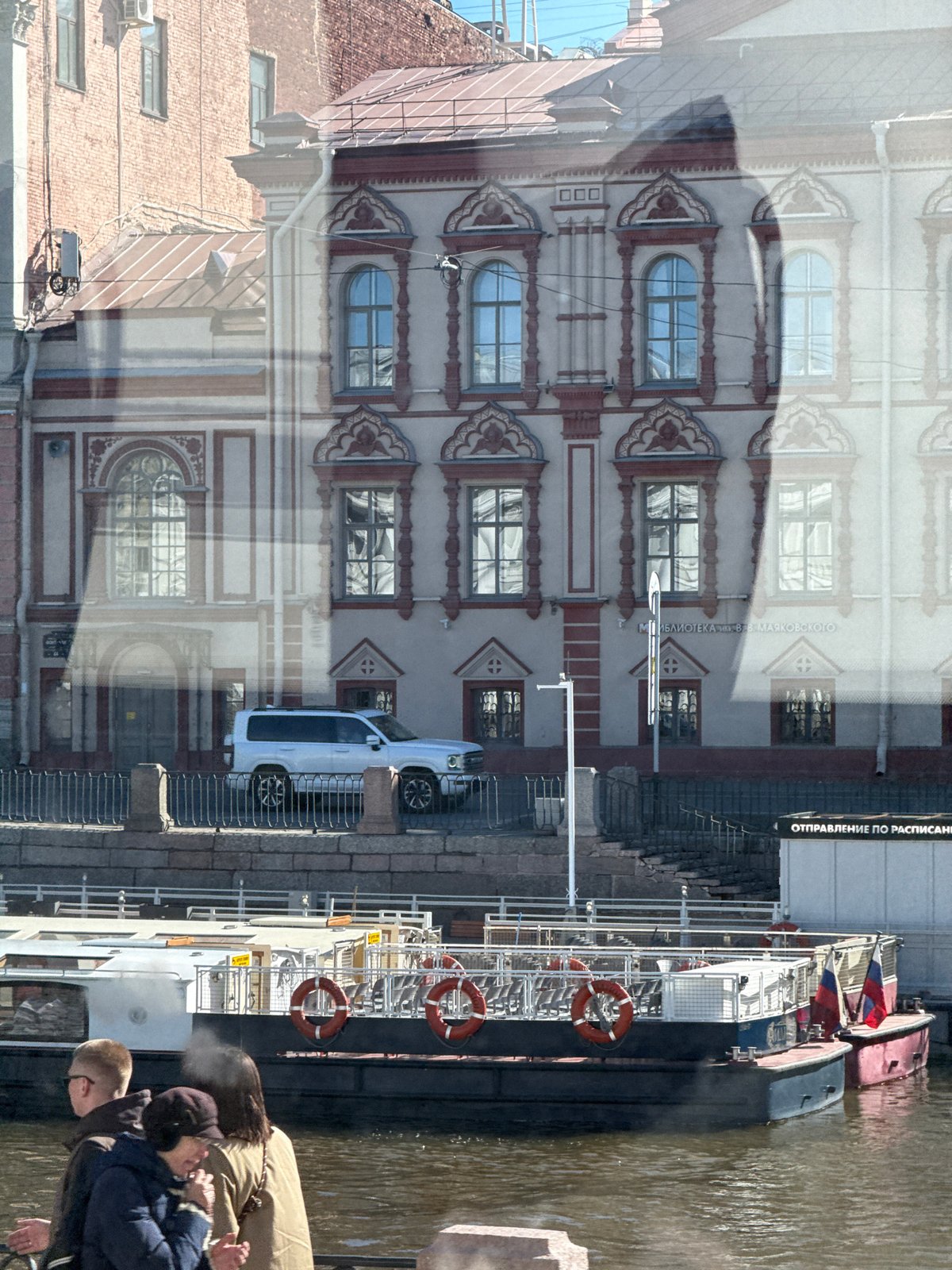 Morning sightseeing captures historic Saint Petersburg architecture, pedestrians
