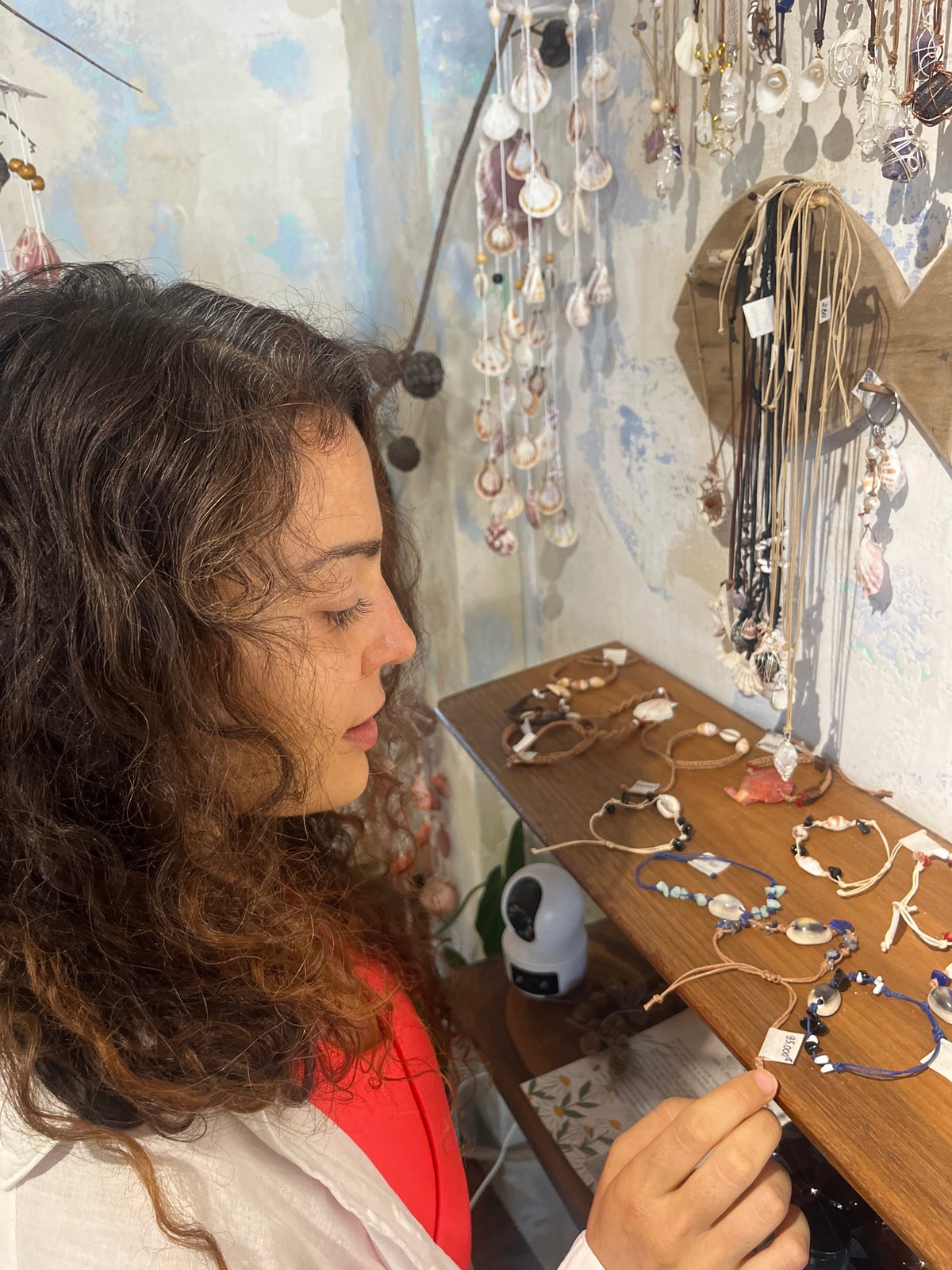 Browsing handmade jewelry and artisan goods in Phu Thuy Ward