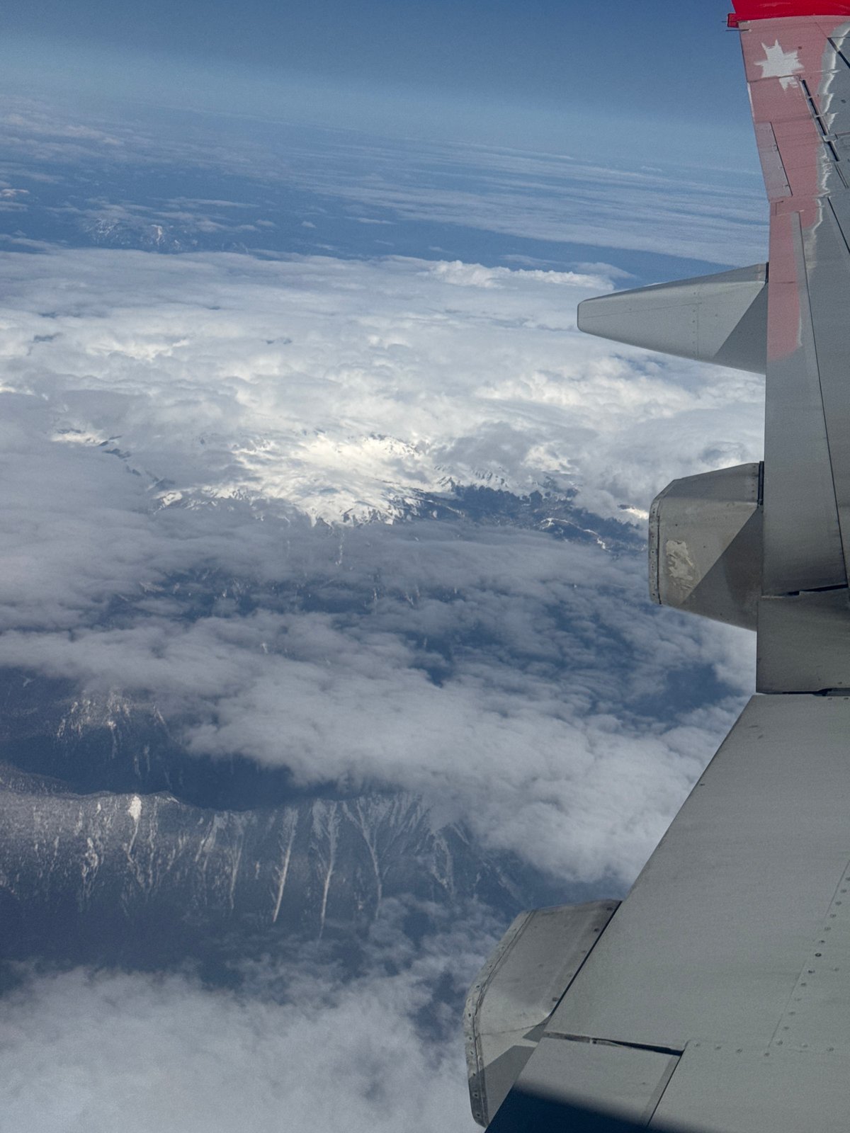 Aircraft flight documented over rural Russia with agricultural landscape views
