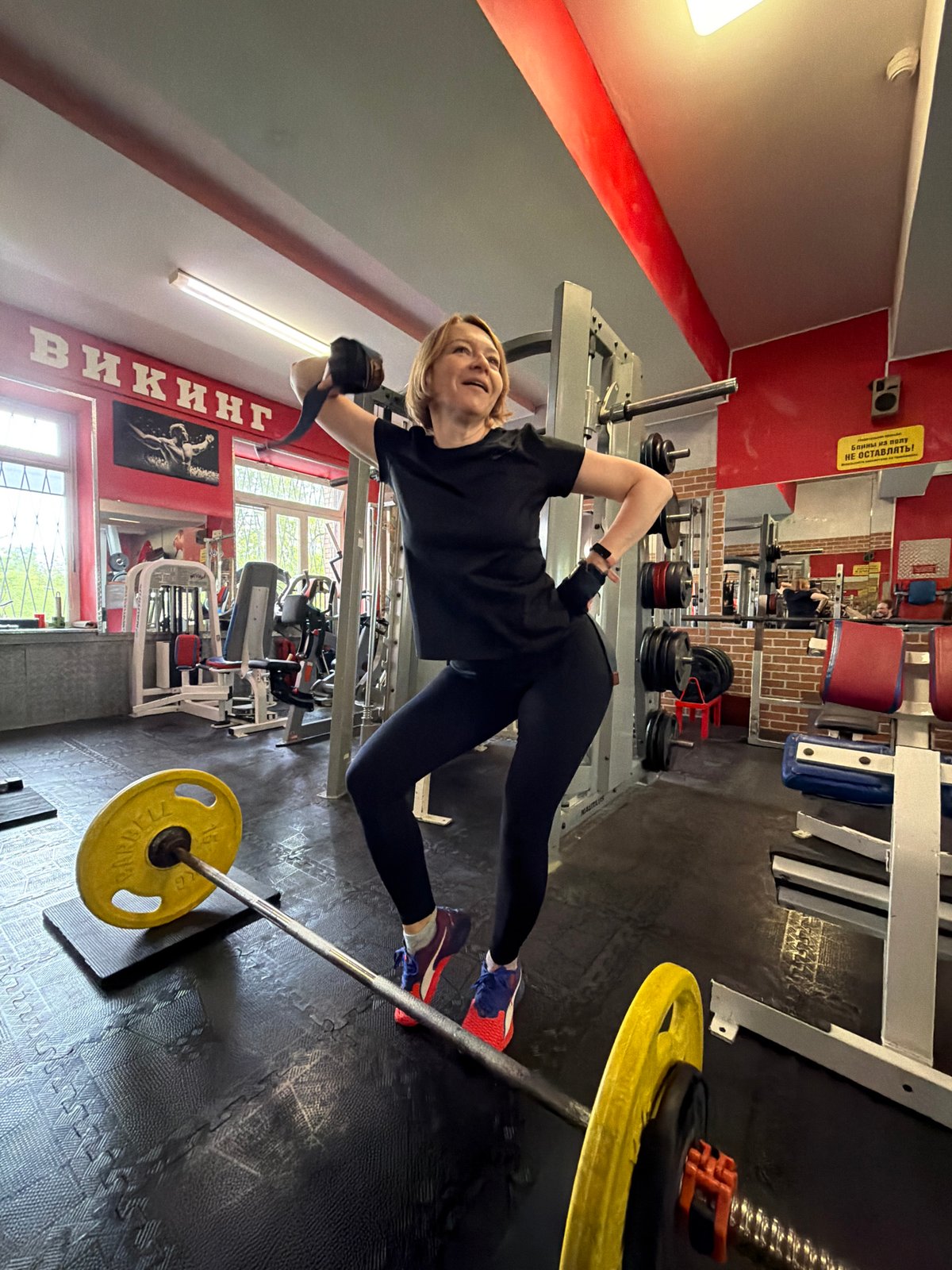 Woman completes strength training workout at Saint Petersburg gym