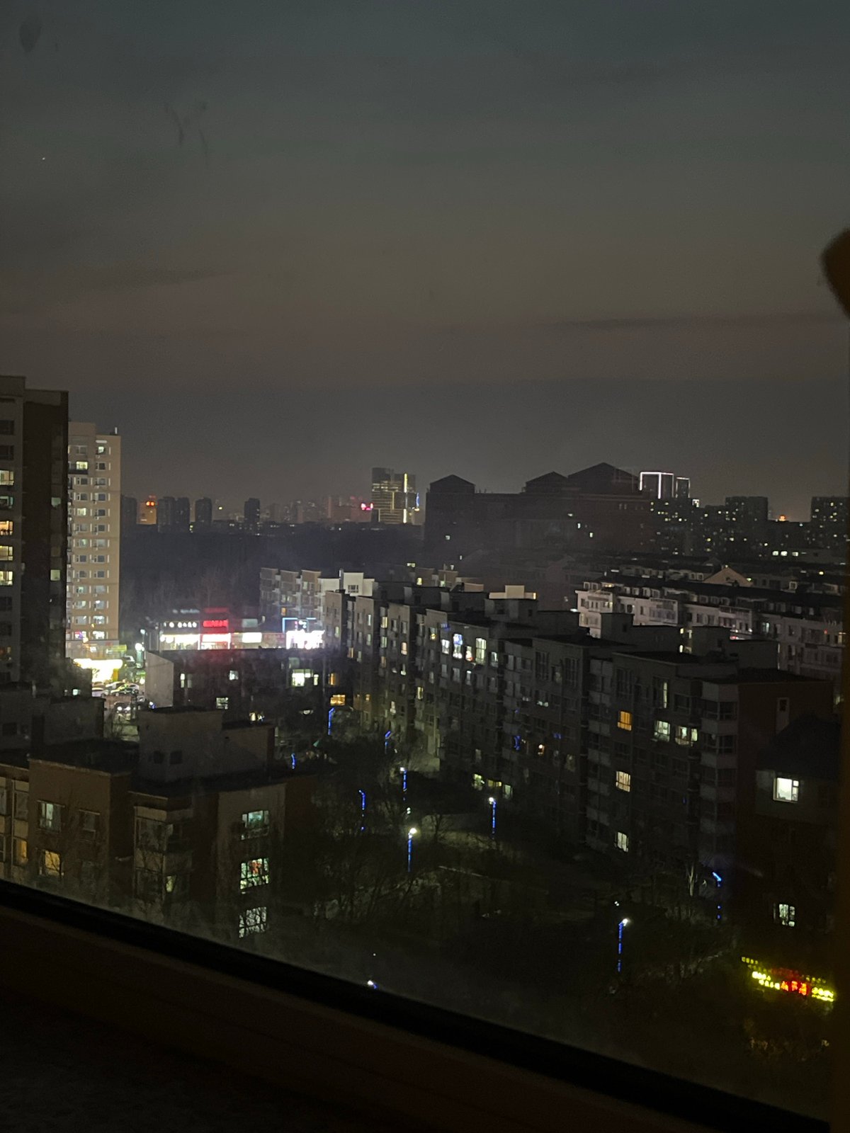 Night cityscape views captured through windows in Changchun