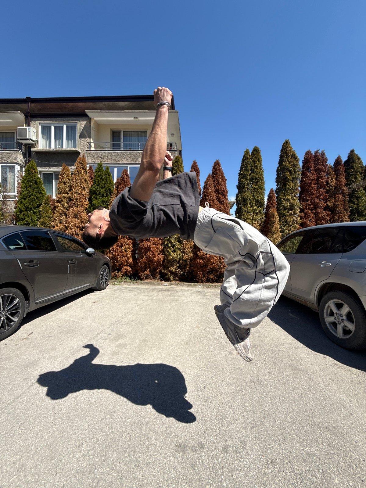 Man performs backflips on street in Shumen, Bulgaria