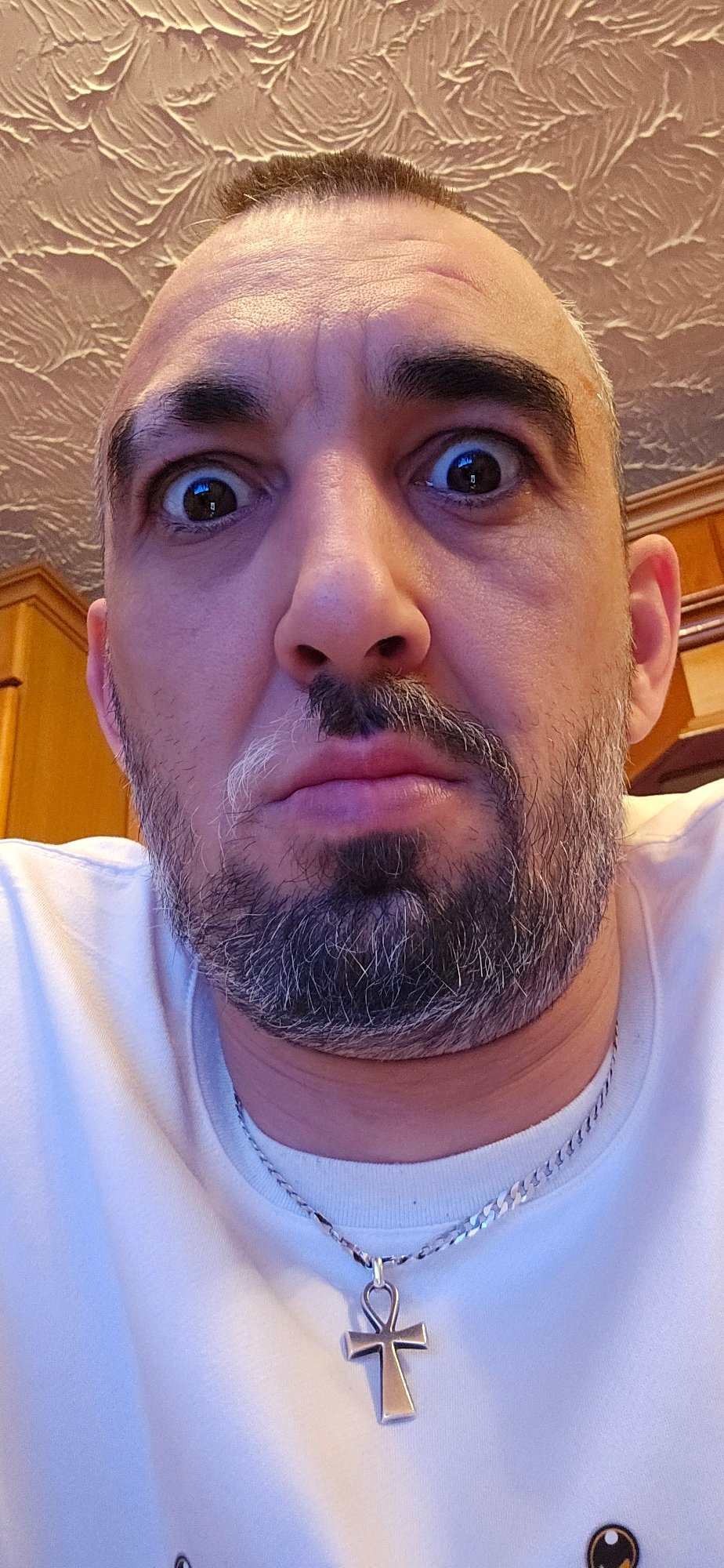 Man photographed in Norwich home, multiple angles captured