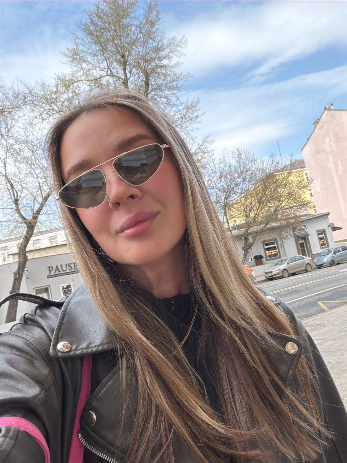 Woman takes selfie on sunny morning in Moscow