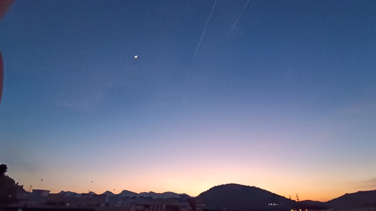 Evening sky watching captures twilight moon in Sagunto
