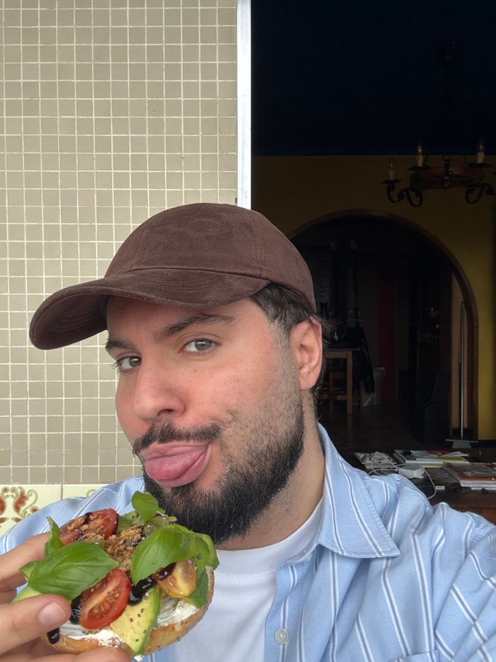 Man enjoys avocado toast breakfast in Vila Nova de Gaia