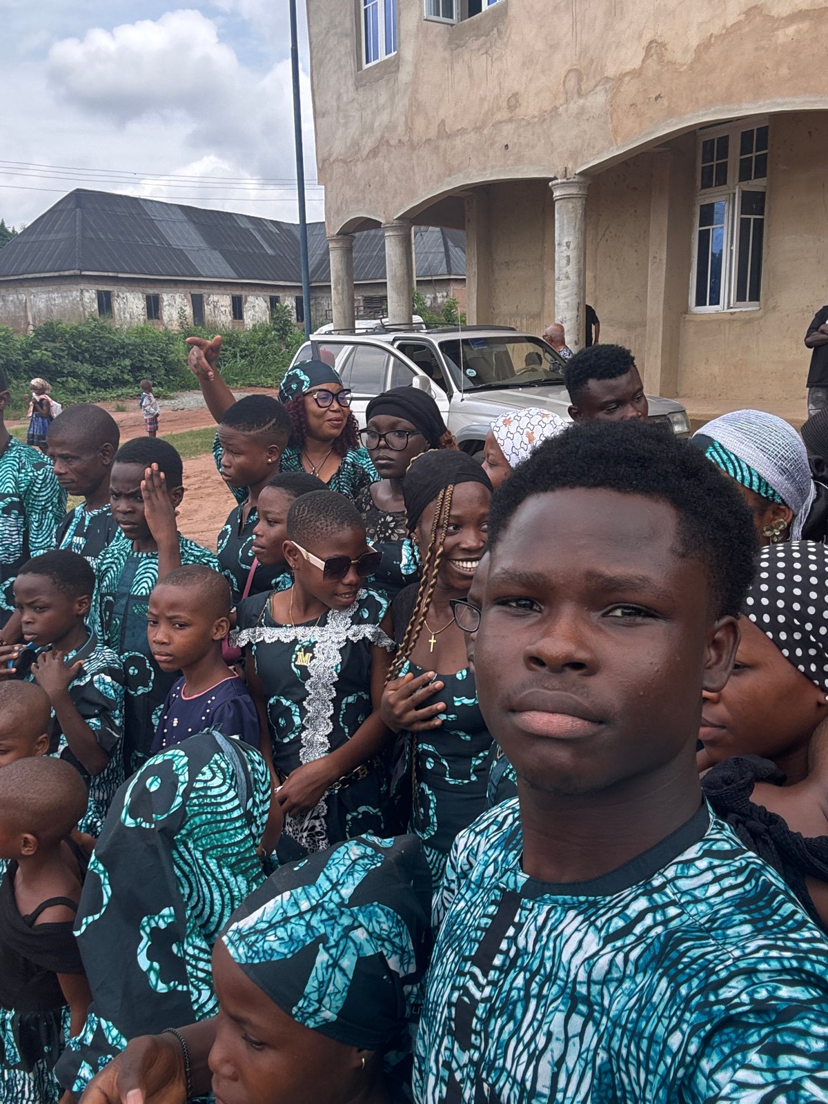 Coordinated group gathering for photos in Eziudo, Nigeria