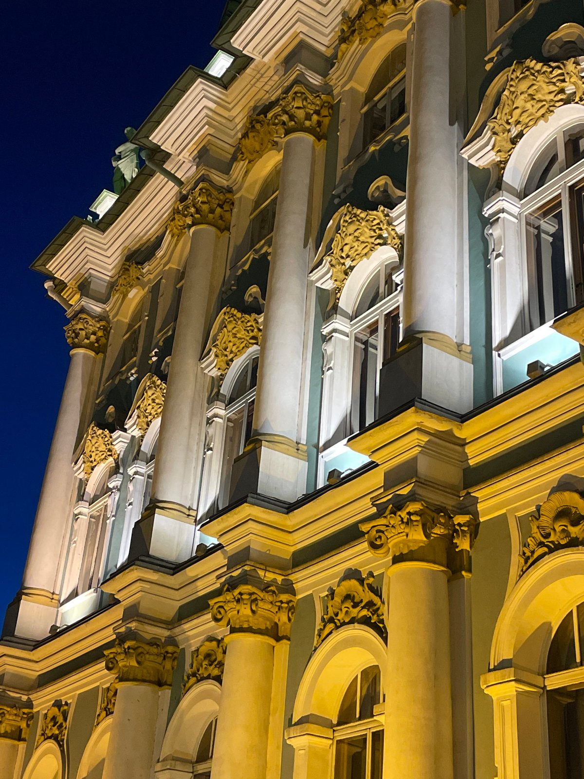 Ornate Saint Petersburg building photographed at night from multiple angles