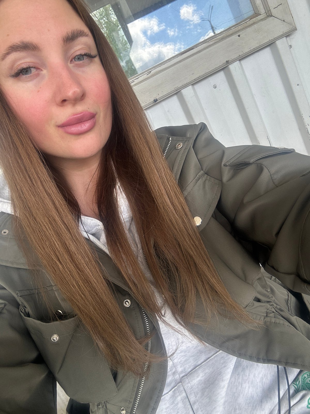 Woman visits transportation hub in Chaikovsky, Russia morning hours